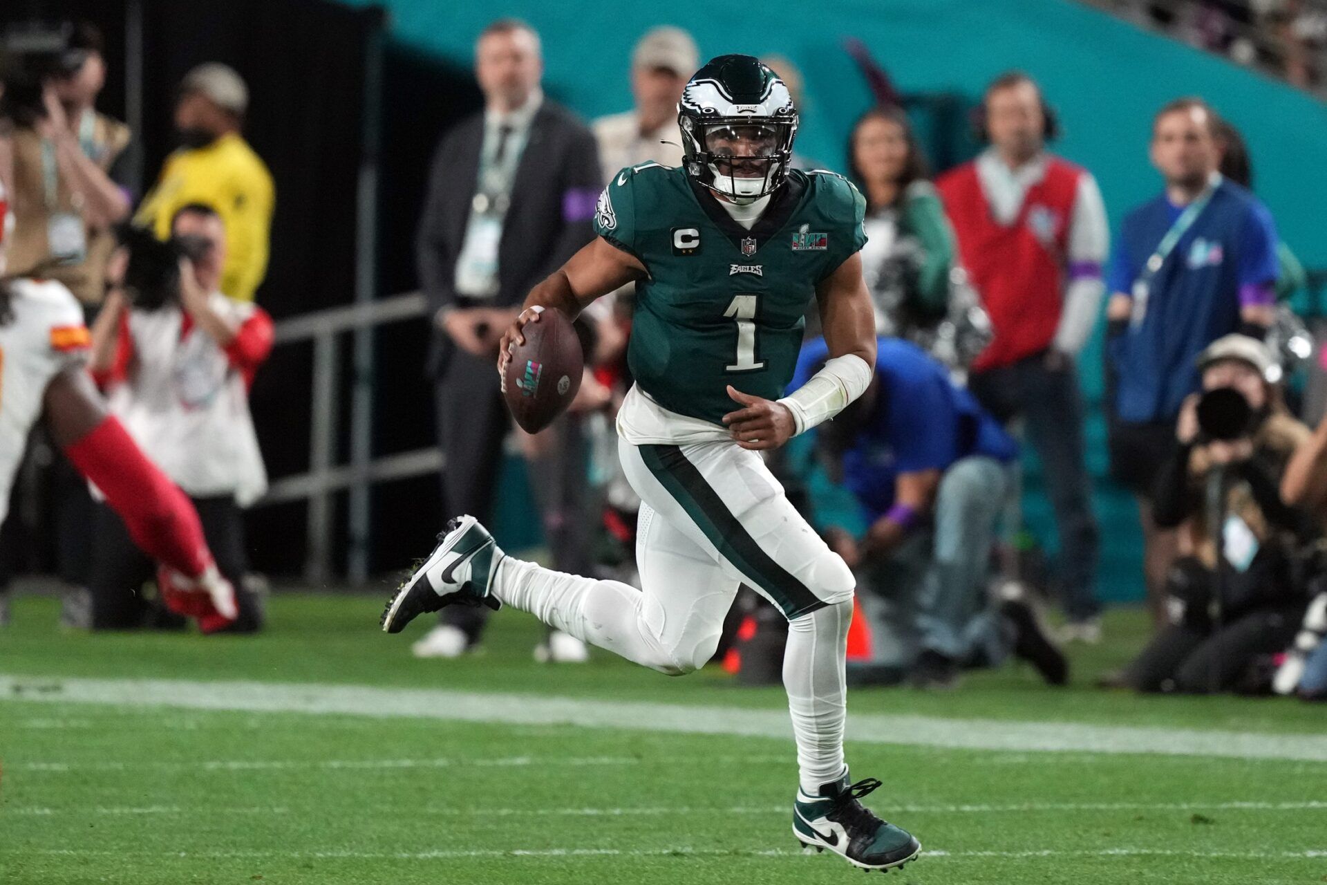 Philadelphia Eagles quarterback Jalen Hurts (1) runs against the Kansas City Chiefs in the fourth quarter of Super Bowl LVII at State Farm Stadium.