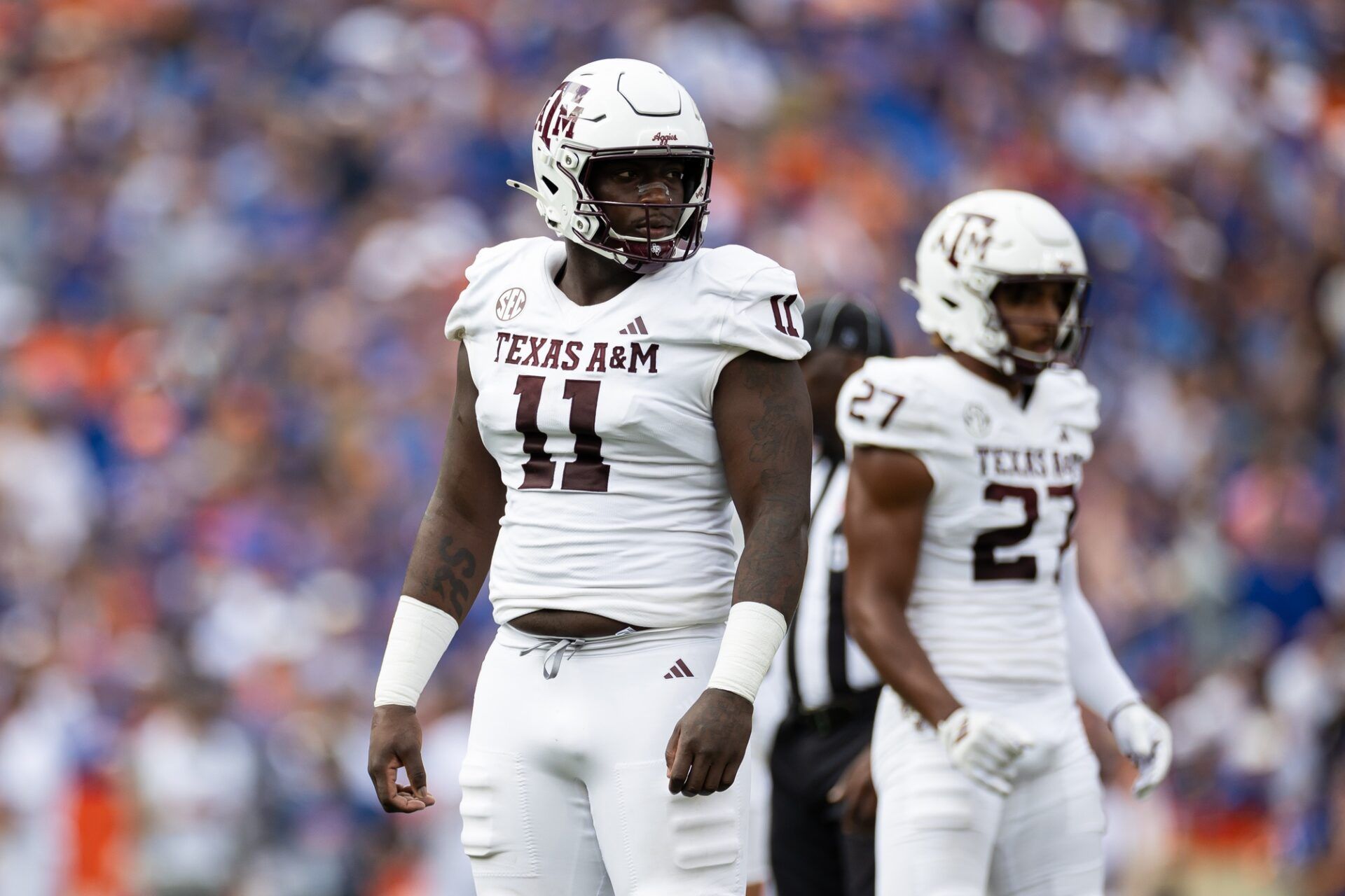 Texas A&M Aggies defensive lineman Nic Scourton (11) looks toward the sideline against the Florida Gators during the first half at Ben Hill Griffin Stadium.