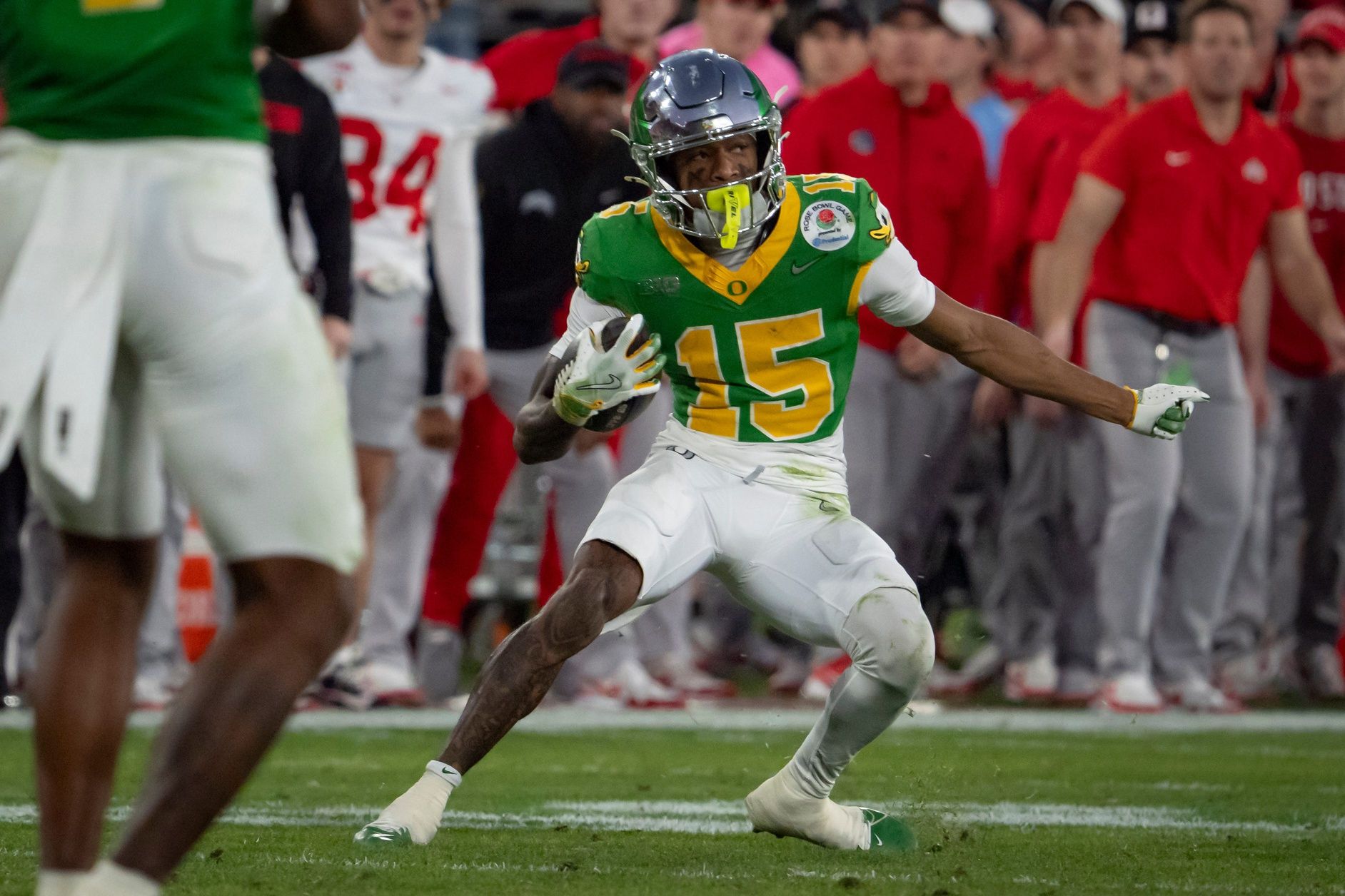 Oregon wide receiver Tez Johnson carries the ball as the Oregon Ducks face the Ohio State Buckeyes Wednesday, Jan. 1, 2025, in the quarterfinal of the College Football Playoff at the Rose Bowl in Pasadena, Calif.