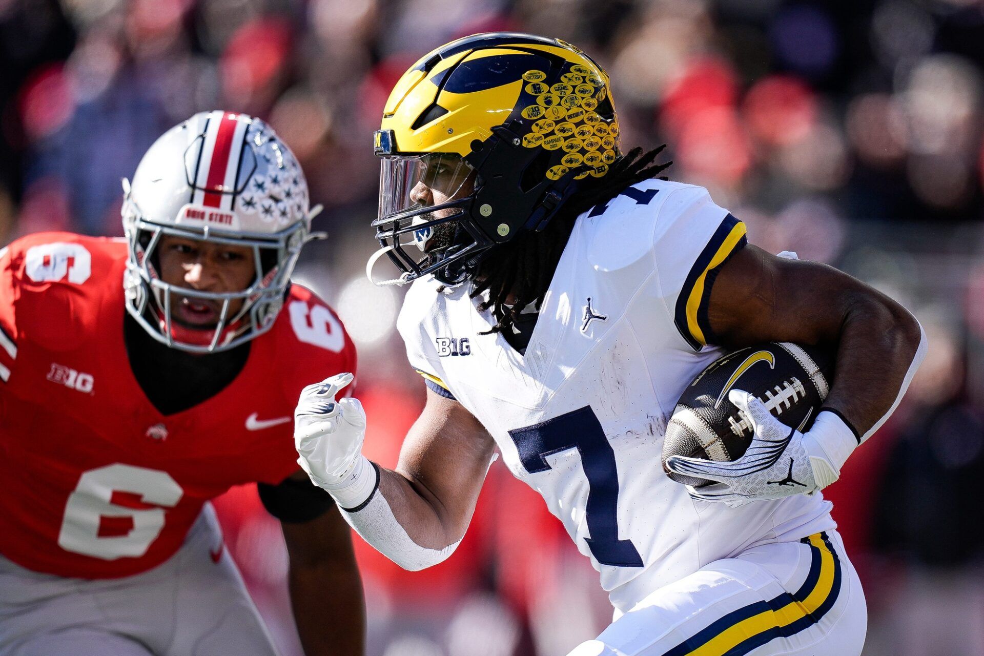 Michigan running back Donovan Edwards (7) runs against Ohio State during the first half at Ohio Stadium in Columbus, Ohio on Saturday, Nov. 30, 2024.