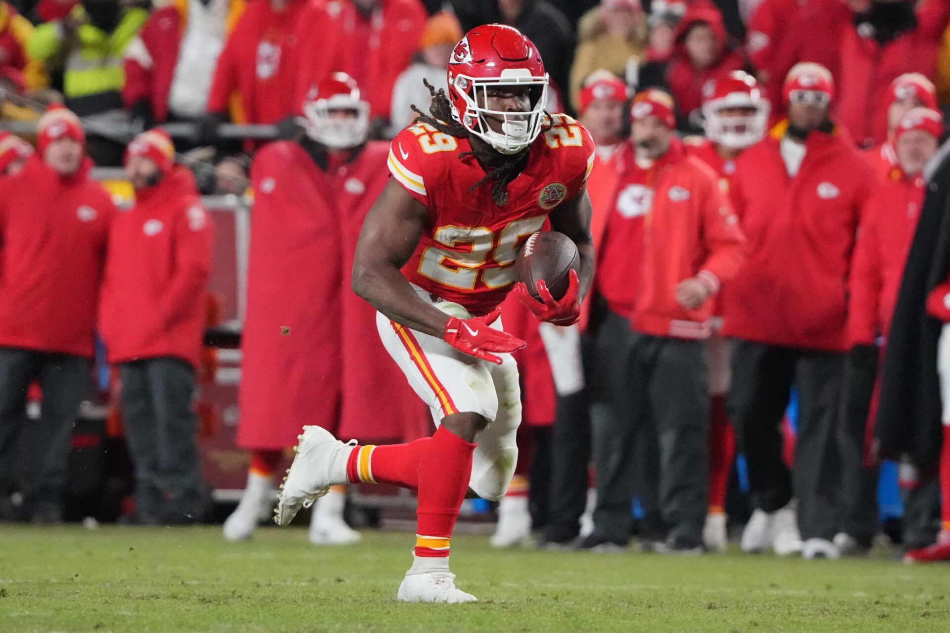 Kansas City Chiefs running back Kareem Hunt (29) runs the ball against the Houston Texans during the fourth quarter of a 2025 AFC divisional round game at GEHA Field at Arrowhead Stadium.