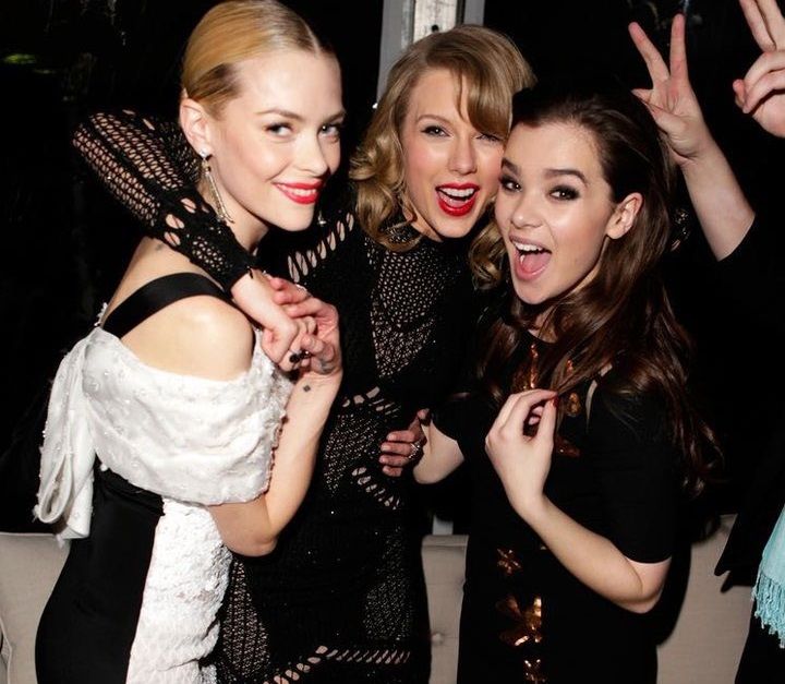 Taylor Swift and Hailee Steinfeld hanging out at an event.