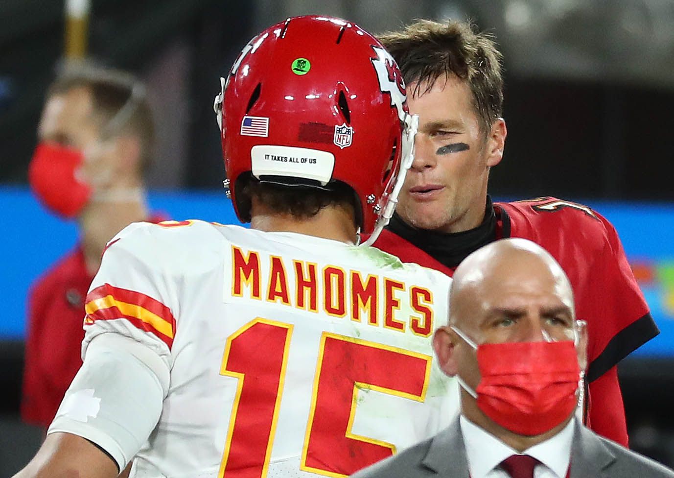 Kansas City Chiefs quarterback Patrick Mahomes (15) meets with Tampa Bay Buccaneers quarterback Tom Brady (12) following the victory at Raymond James Stadium.