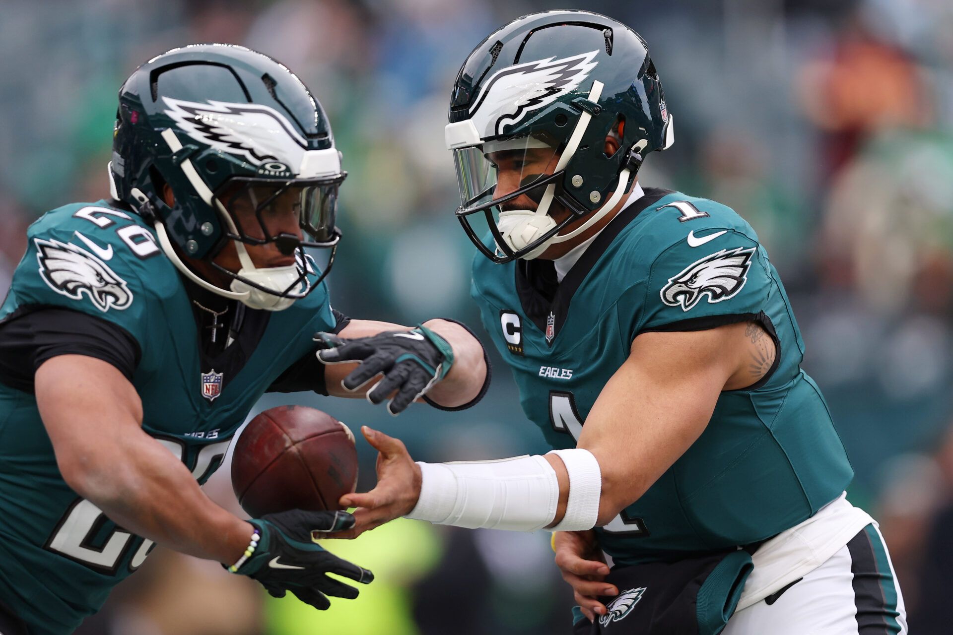 Jan 26, 2025; Philadelphia, PA, USA; Philadelphia Eagles quarterback Jalen Hurts (1) and running back Saquon Barkley (26) warm up before the NFC Championship game at Lincoln Financial Field. Mandatory Credit: Bill Streicher-Imagn Images