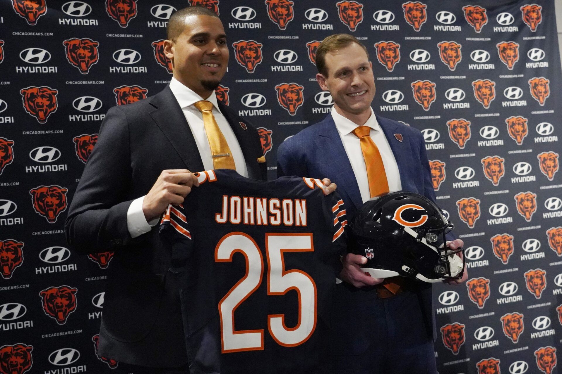 Chicago Bears new head coach Ben Johnson (right) with general manager Ryan Poles pose for photos after a press conference introducing him at PNC Center.