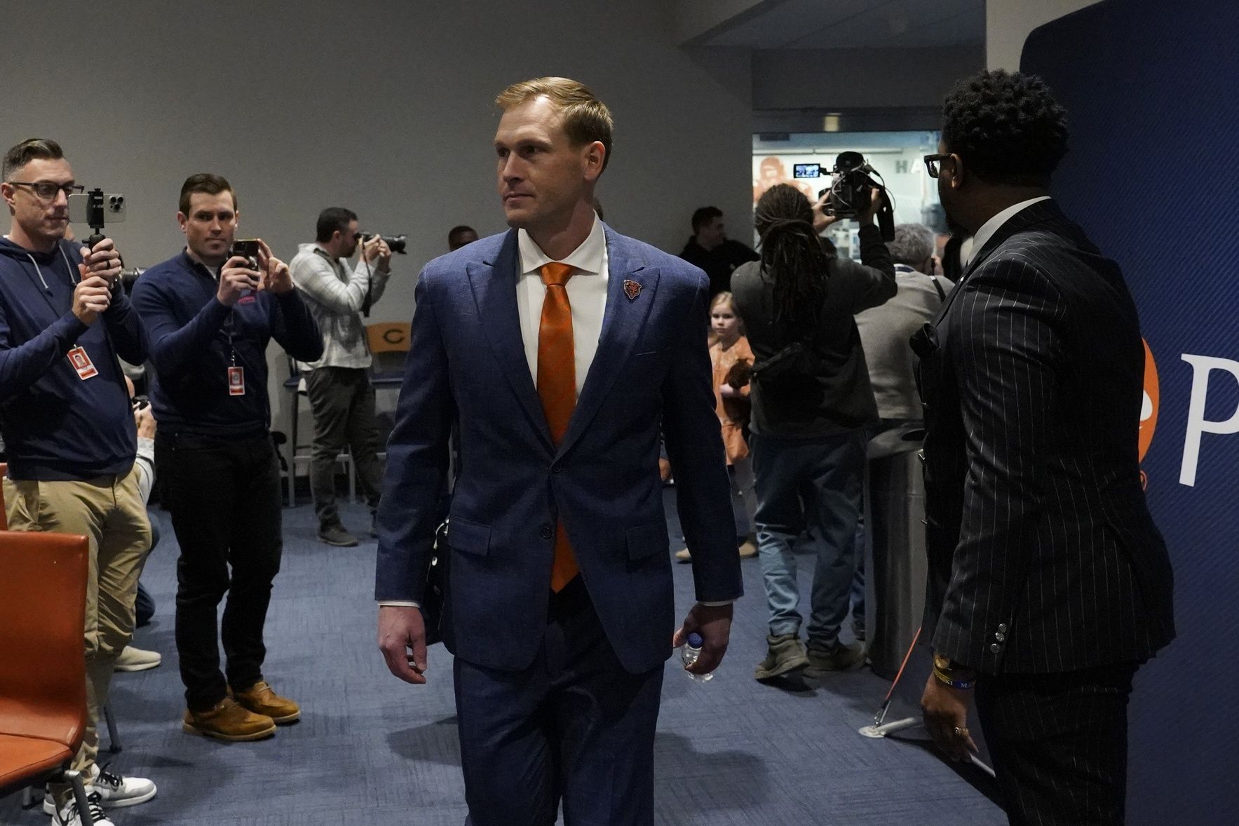 Chicago Bears new head coach Ben Johnson enters as hes introduced at a press conference at PNC Center.