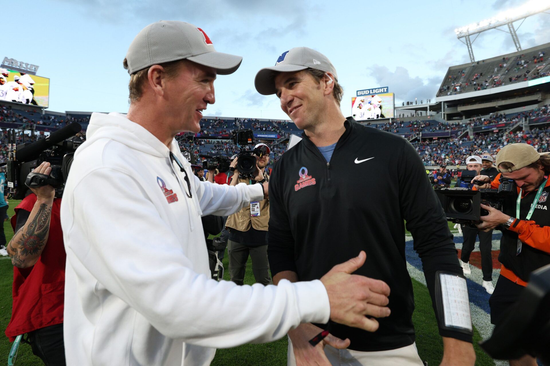 NFC coach Eli Manning and AFC coach Peyton Manning react after the 2024 Pro Bowl at Camping World Stadium.