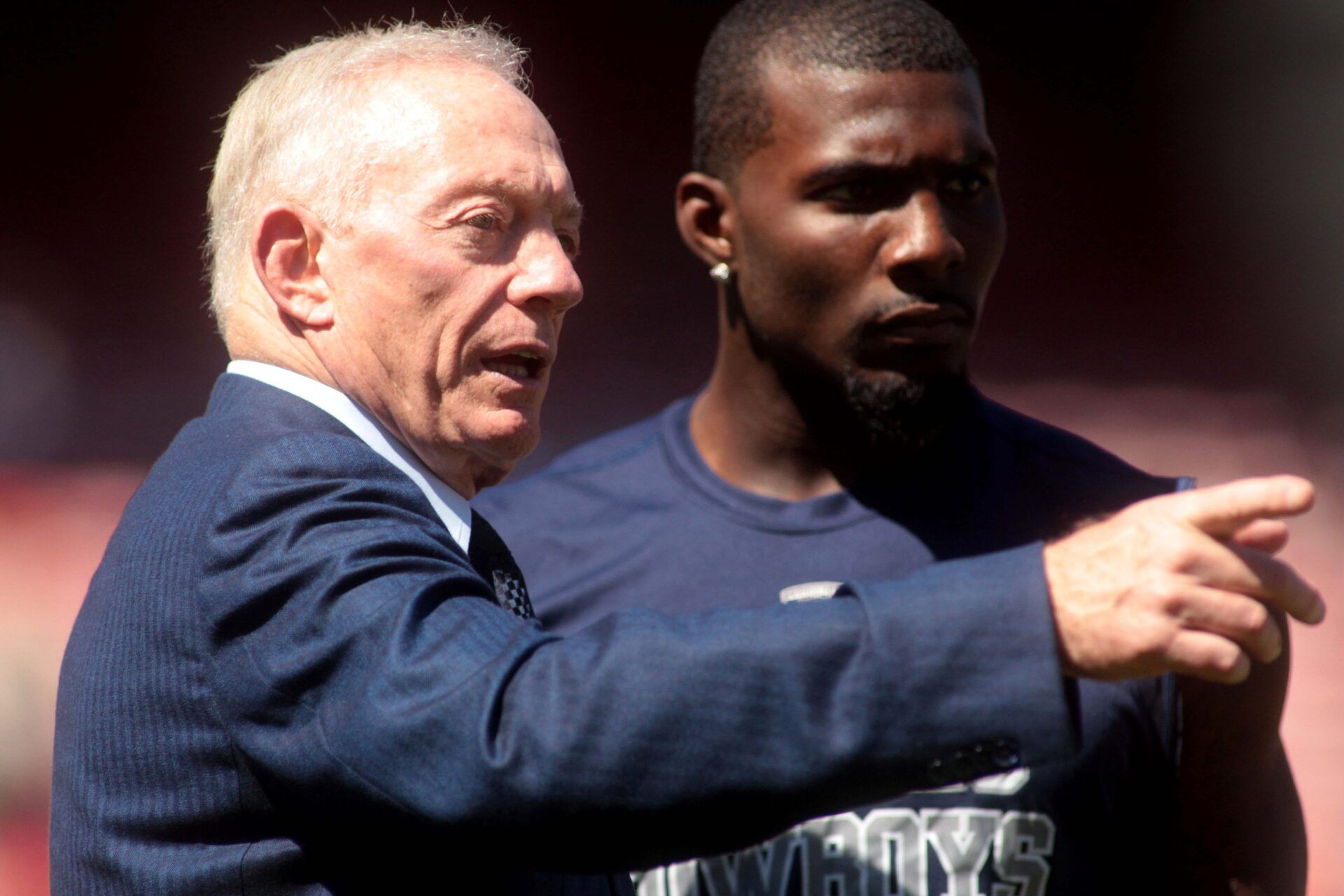 Dallas Cowboys owner Jerry Jones talks with wide receiver Dez Bryant before the start of the game against the San Francisco 49ers at Candlestick Park.