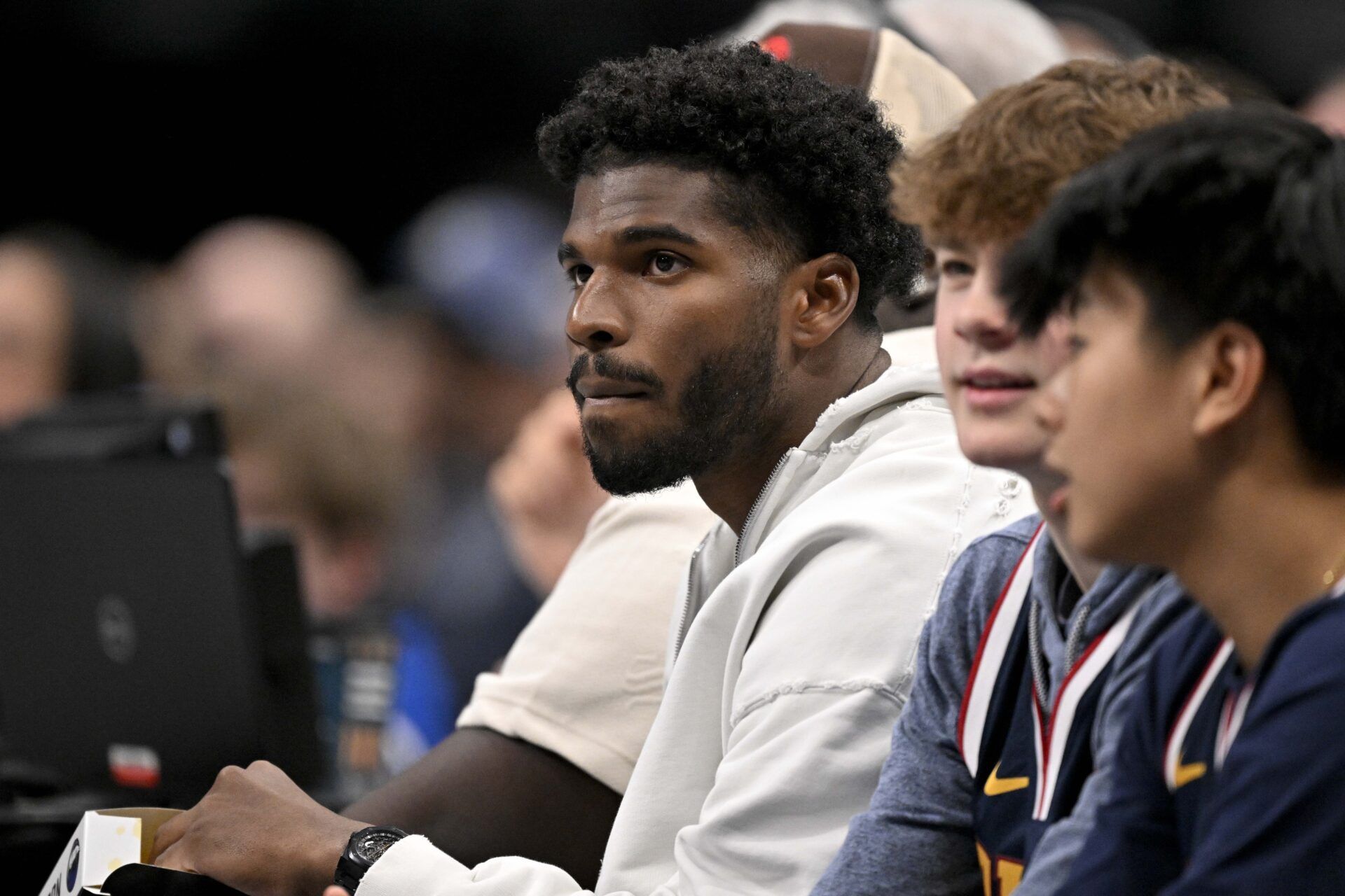 Jan 14, 2025; Dallas, Texas, USA; Colorado Buffaloes quarterback Shedeur Sanders watches the game between the Dallas Mavericks and the Denver Nuggets during the second quarter at the American Airlines Center. Mandatory Credit: Jerome Miron-Imagn Images