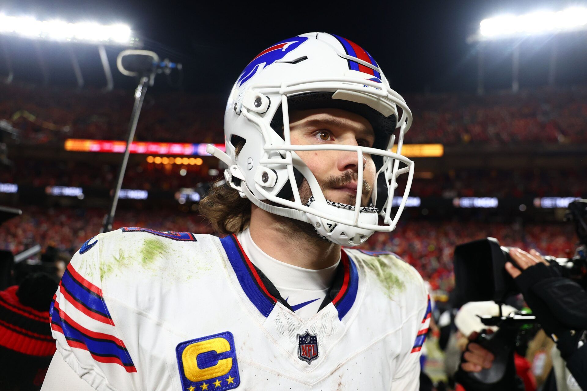 Buffalo Bills quarterback Josh Allen (17) walks off the field after the AFC Championship game against the Kansas City Chiefs at GEHA Field at Arrowhead Stadium.