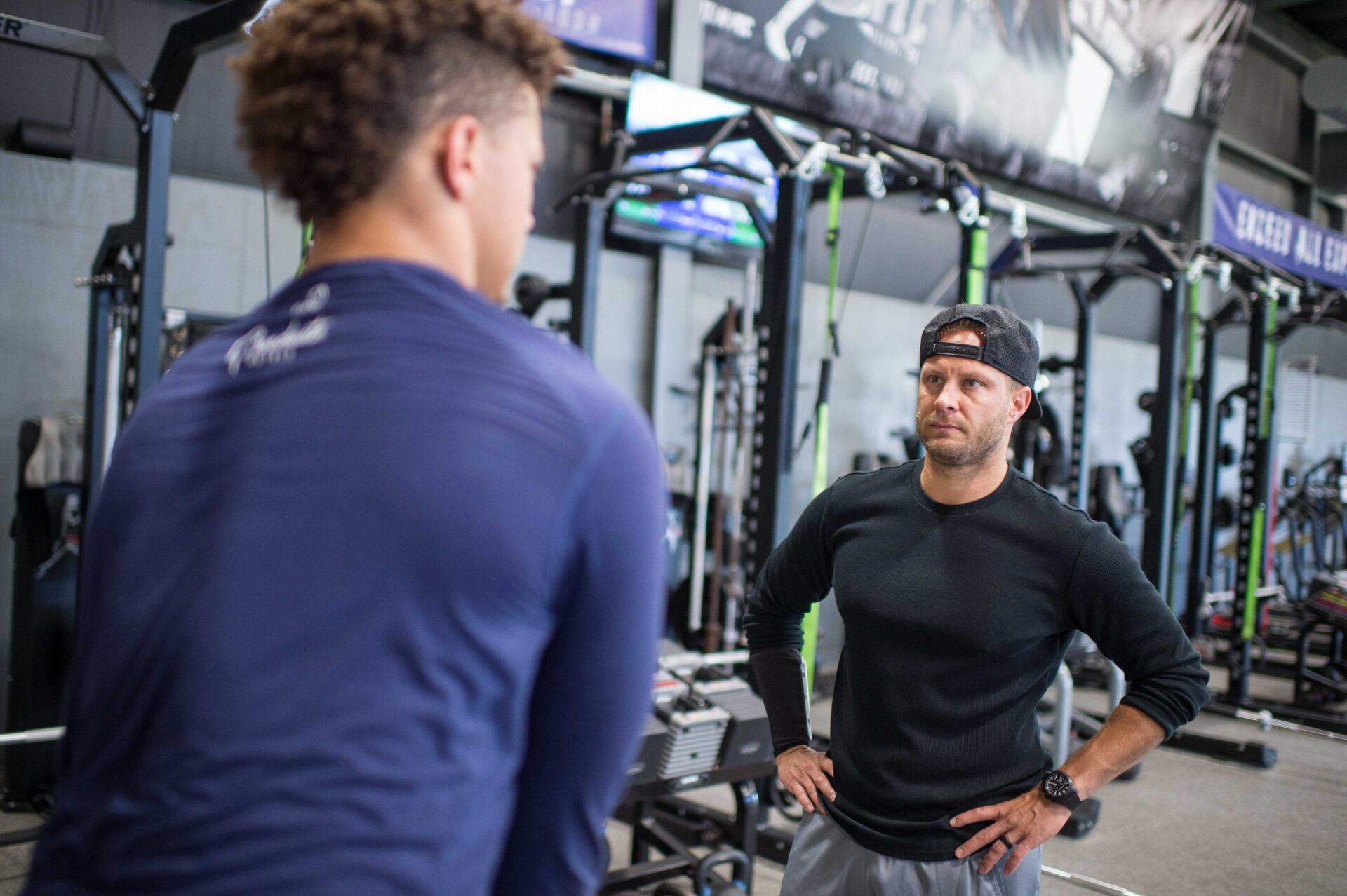 Patrick Mahomes (left), quarterback from the Texas Tech Red Raiders, trains at the APEC training facility in Tyler, TX with facility owner Bobby Stroupe (right).