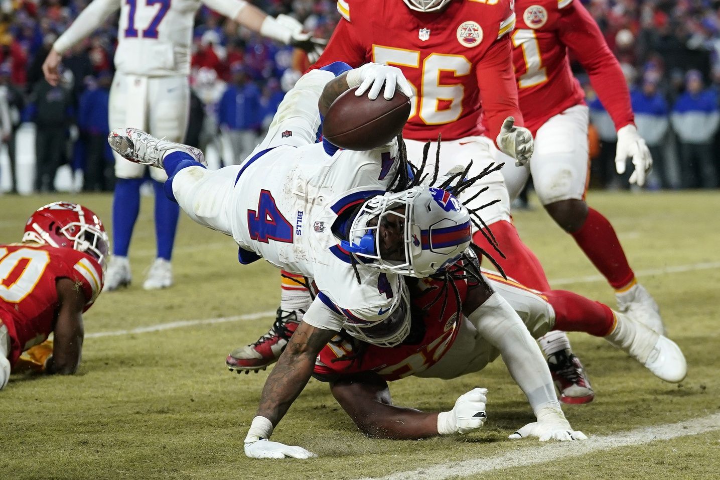 Buffalo Bills running back James Cook (4) dives for a touchdown against the Kansas City Chiefs during the second half in the AFC Championship game at GEHA Field at Arrowhead Stadium.