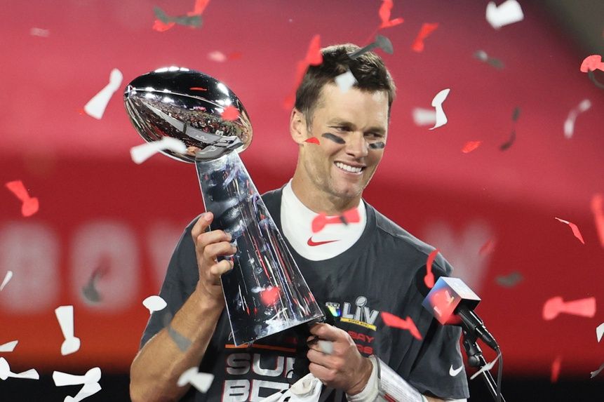 Tampa Bay Buccaneers quarterback Tom Brady (12) hoists the Vince Lombardi Trophy after defeating the Kansas City Chiefs in Super Bowl LV at Raymond James Stadium.