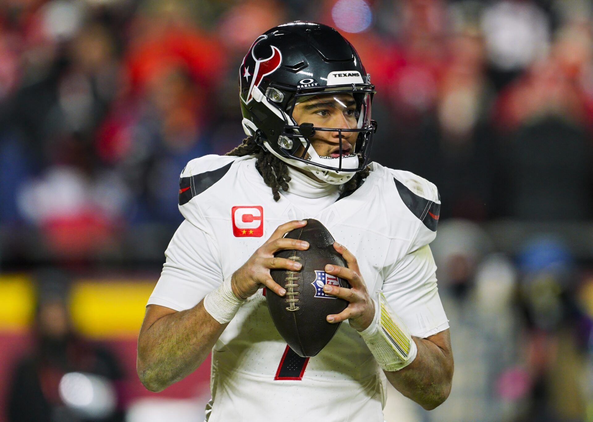 Houston Texans quarterback C.J. Stroud (7) drops back to pass during the second half against the Kansas City Chiefs in a 2025 AFC divisional round game at GEHA Field at Arrowhead Stadium.