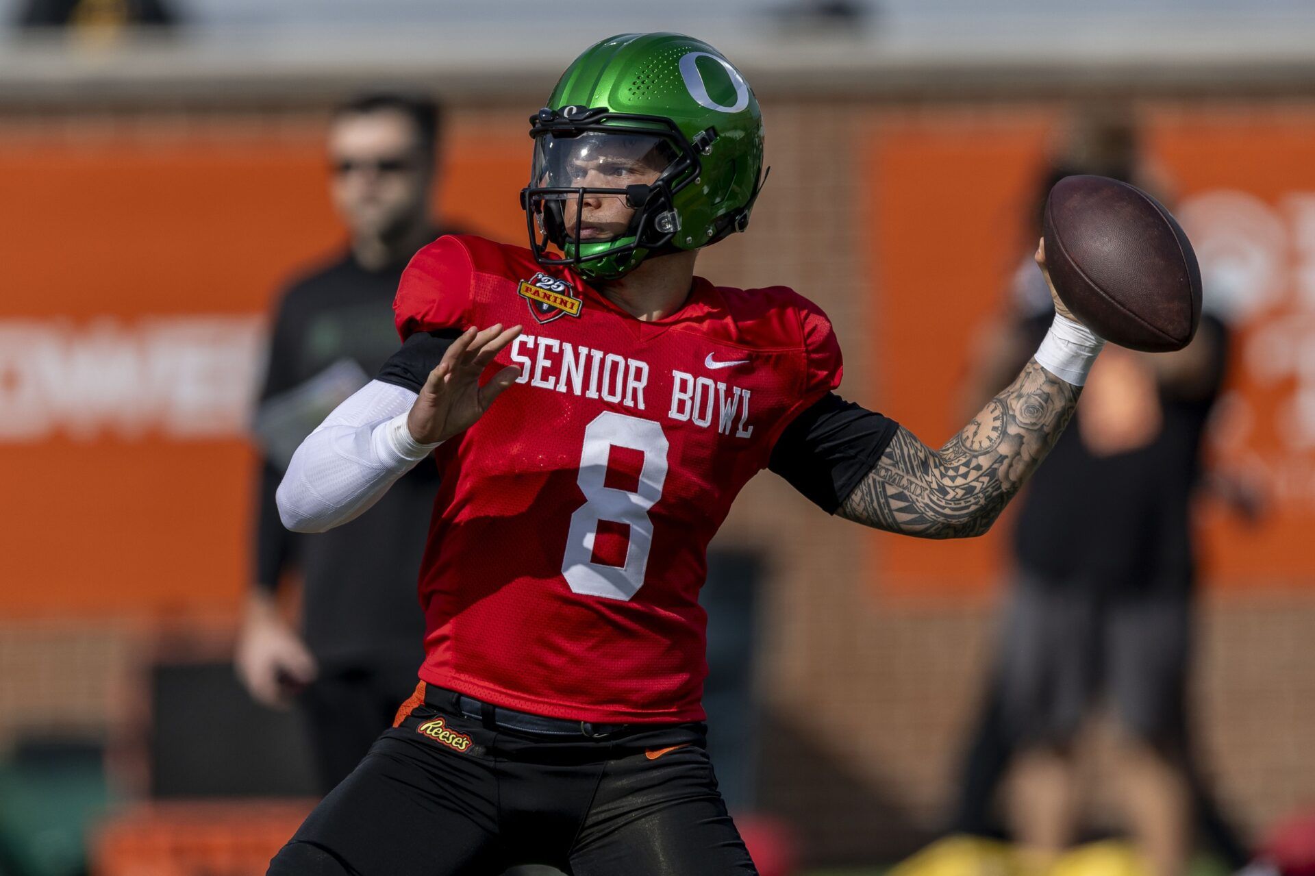 National team quarterback Dillon Gabriel of Oregon (8) throws the ball during Senior Bowl practice for the National team at Hancock Whitney Stadium.