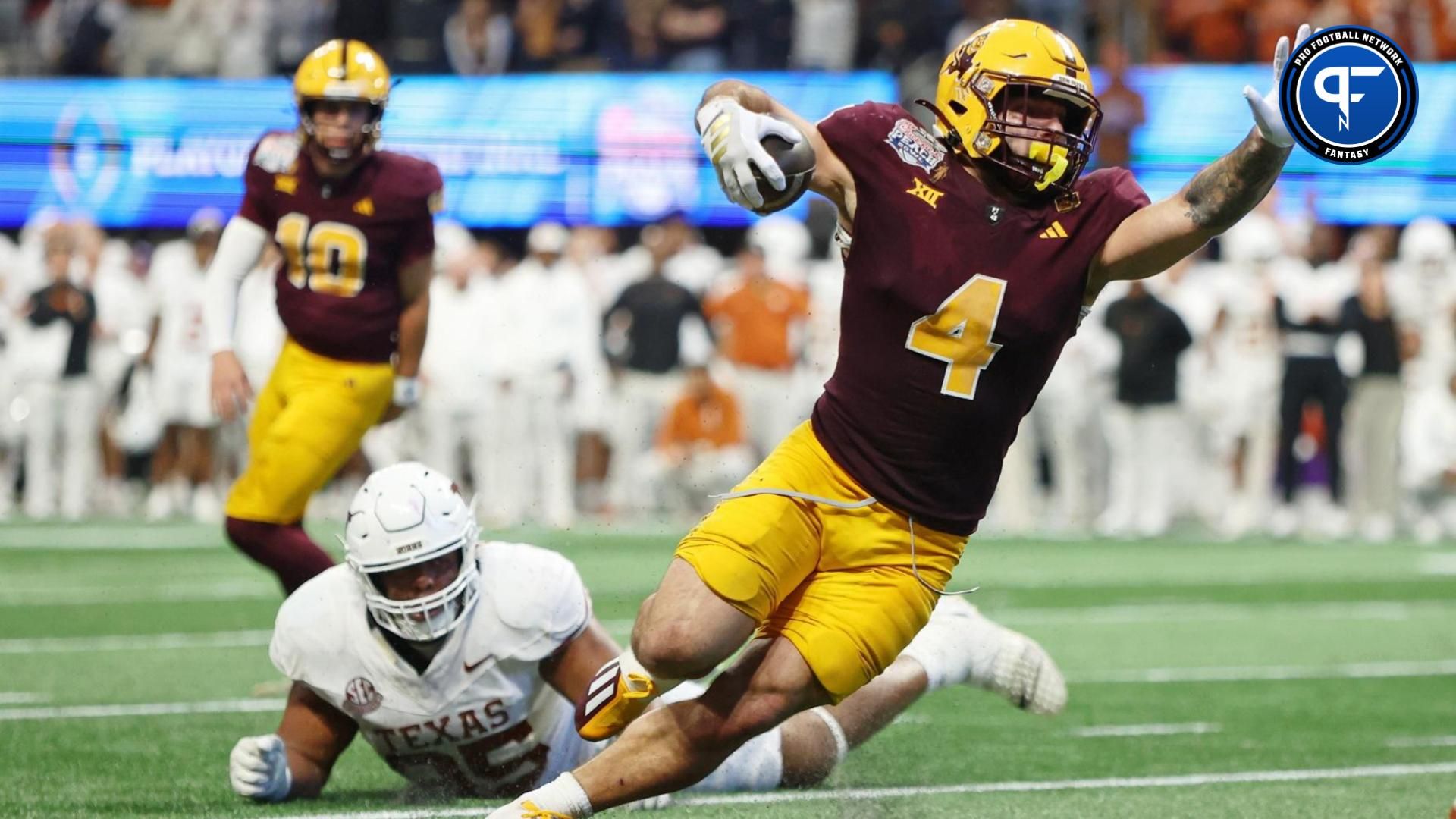 Arizona State Sun Devils running back Cam Skattebo (4) runs with the ball for a touchdown against the Texas Longhorns during the second half of the Peach Bowl at Mercedes-Benz Stadium.