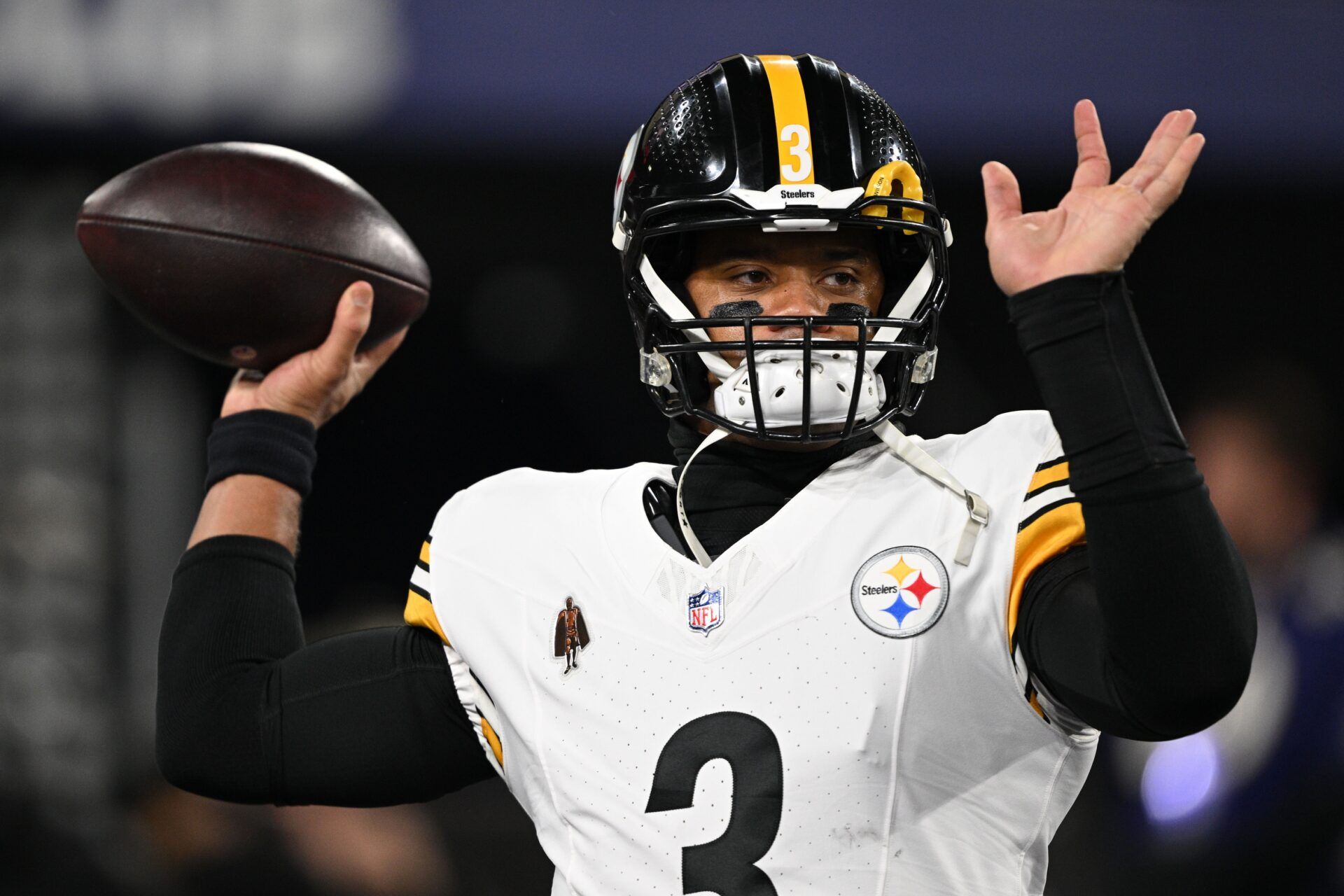 Pittsburgh Steelers quarterback Russell Wilson (3) warms up before an AFC wild card game against the Baltimore Ravens at M&T Bank Stadium.