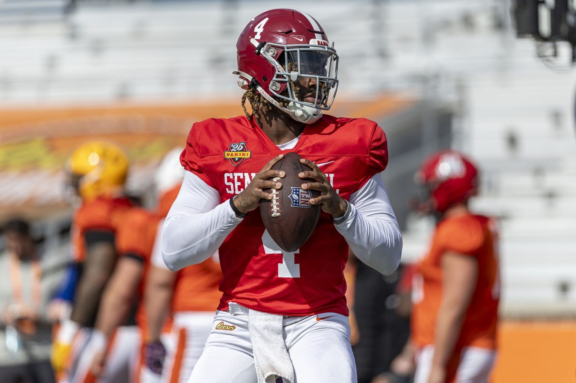 American team quarterback Jalen Milroe of Alabama (4) warms up during Senior Bowl practice for the National team at Hancock Whitney Stadium.