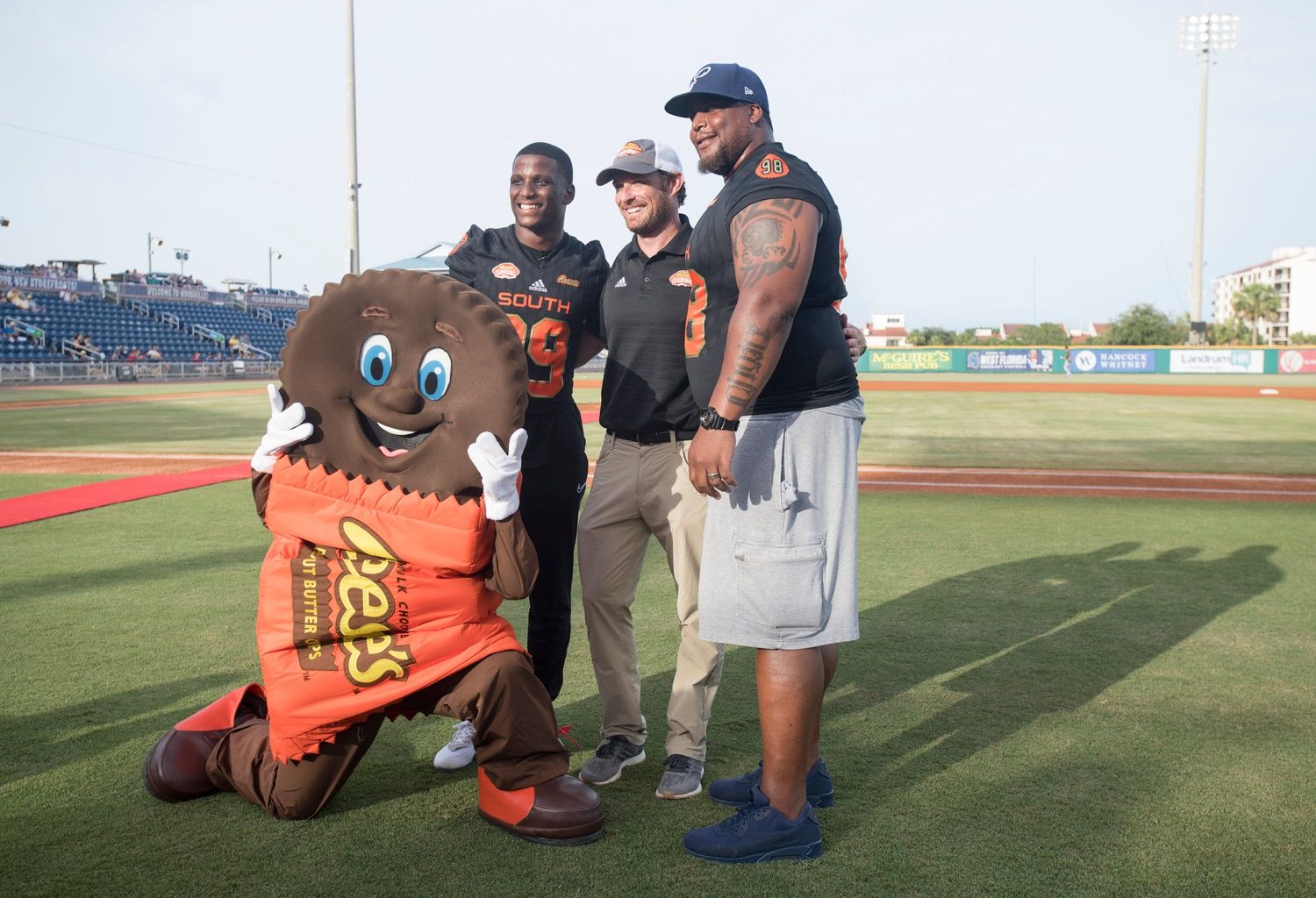 Reese’s mascot Cuppy, from left, Jeremy Reaves, Jim Nagy, and Fred Robbins pose for a photo during Reese’s Senior Bowl Night at Blue Wahoos Stadium in Pensacola on Wednesday, June 26, 2019. Reese S Senior Bowl Night Reeses mascot Cuppy, from left, Jeremy Reaves, Jim Nagy, and Fred Robbins pose for a photo during Reeses Senior Bowl Night at Blue Wahoos Stadium in Pensacola on Wednesday, June 26, 2019.