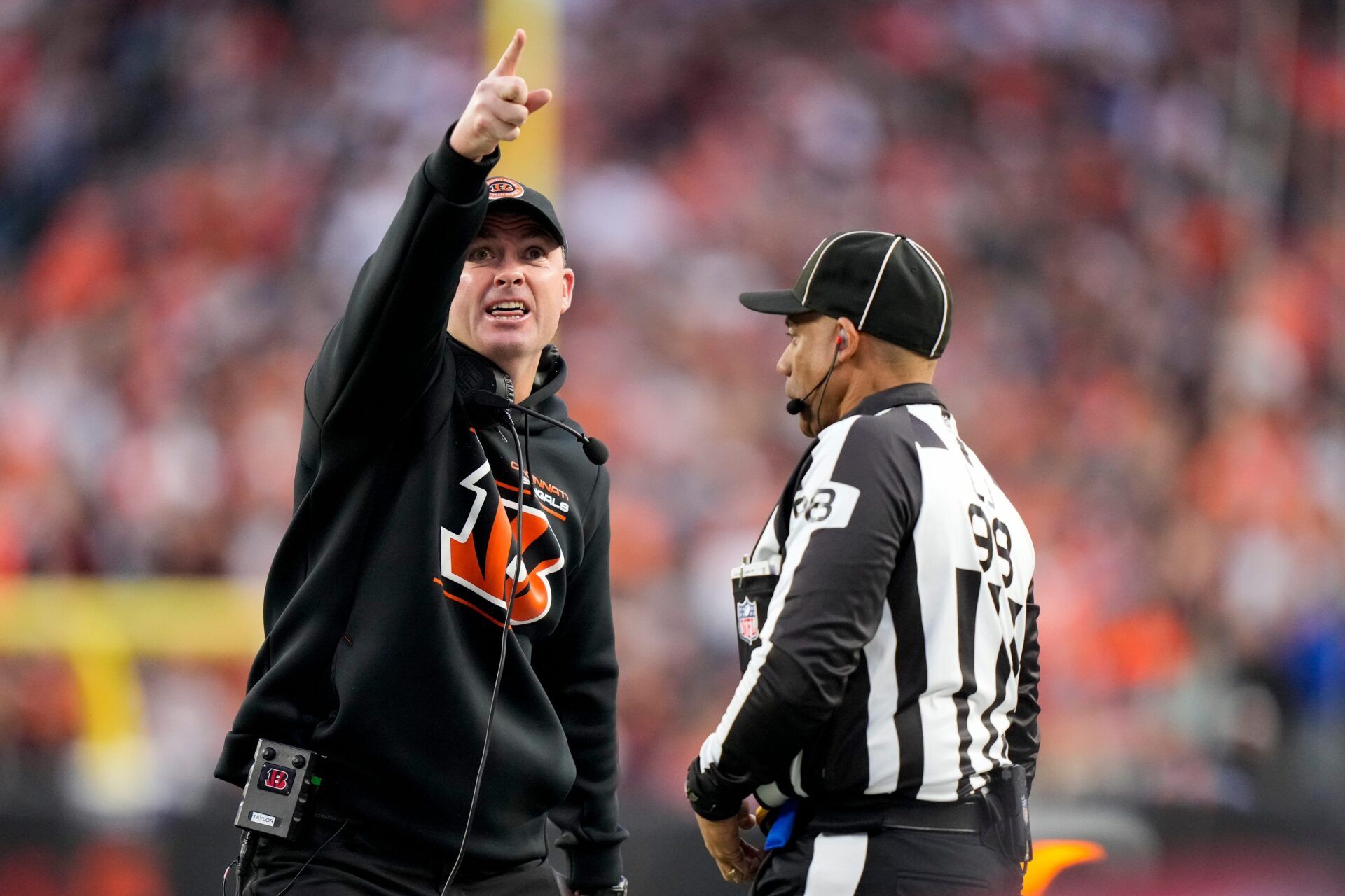 Cincinnati Bengals head coach Zac Taylor shouts at an official as a replay runs on the video board in the first quarter of the NFL Week 17 game between the Cincinnati Bengals and the Denver Broncos at Paycor Stadium in downtown Cincinnati on Saturday, Dec. 28, 2024.