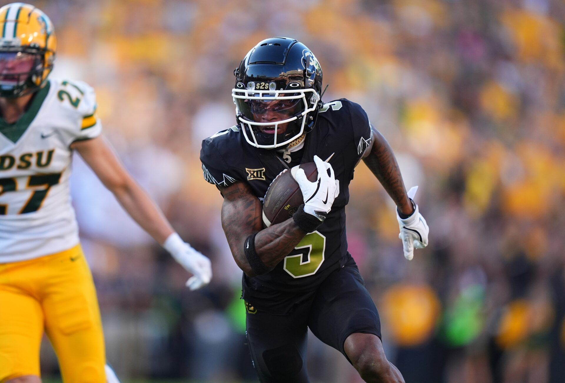 Colorado Buffaloes wide receiver Jimmy Horn Jr. (5) runs after a reception in the first half against the North Dakota State Bison at Folsom Field.