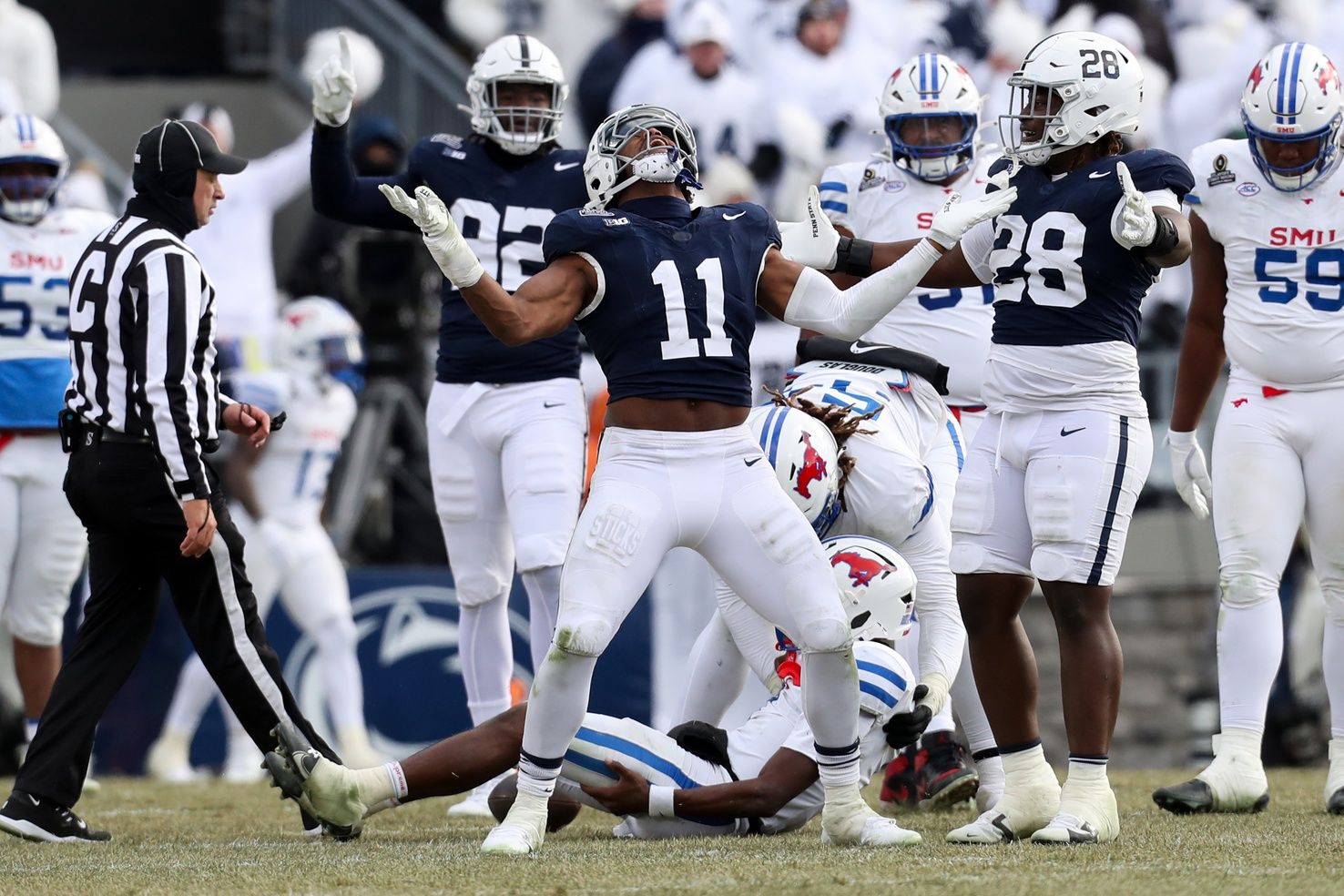 Penn State Nittany Lions defensive end Abdul Carter (11) reacts after sacking Southern Methodist Mustangs quarterback Kevin Jennings (7) during the third quarter in the first round of the College Football Playoff at Beaver Stadium.