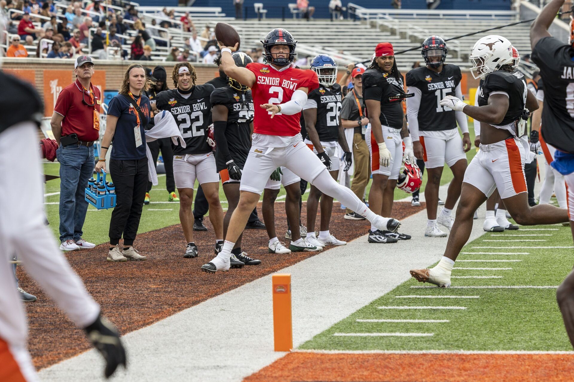 American team quarterback Jaxson Dart of Ole Miss (2) throws the ball on the run during Senior Bowl practice for the American team at Hancock Whitney Stadium.