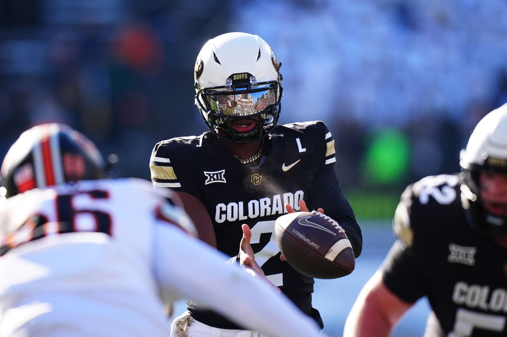 Colorado Buffaloes quarterback Shedeur Sanders (2) takes a hike in the first quarter against the Oklahoma State Cowboys at Folsom Field.