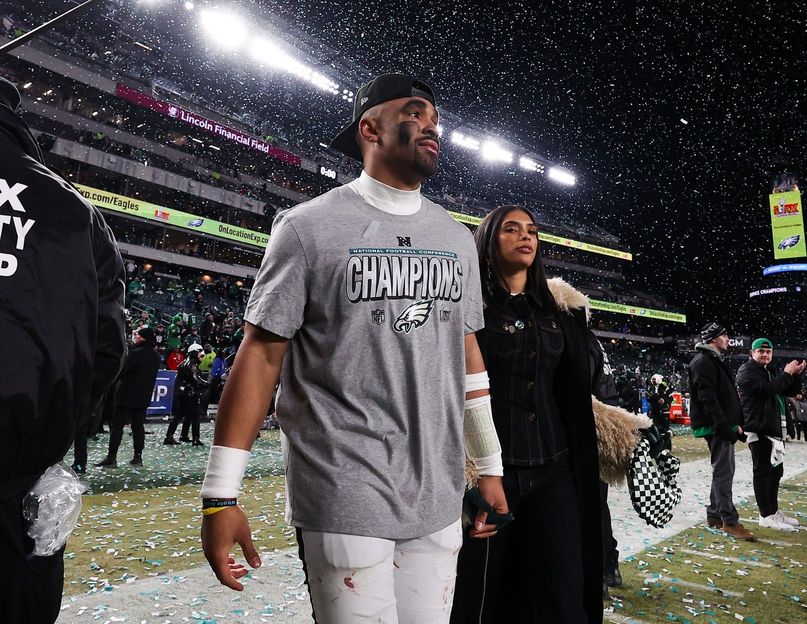 Philadelphia Eagles quarterback Jalen Hurts (1) walks off the field after a victory in the NFC Championship game against the Washington Commanders at Lincoln Financial Field.