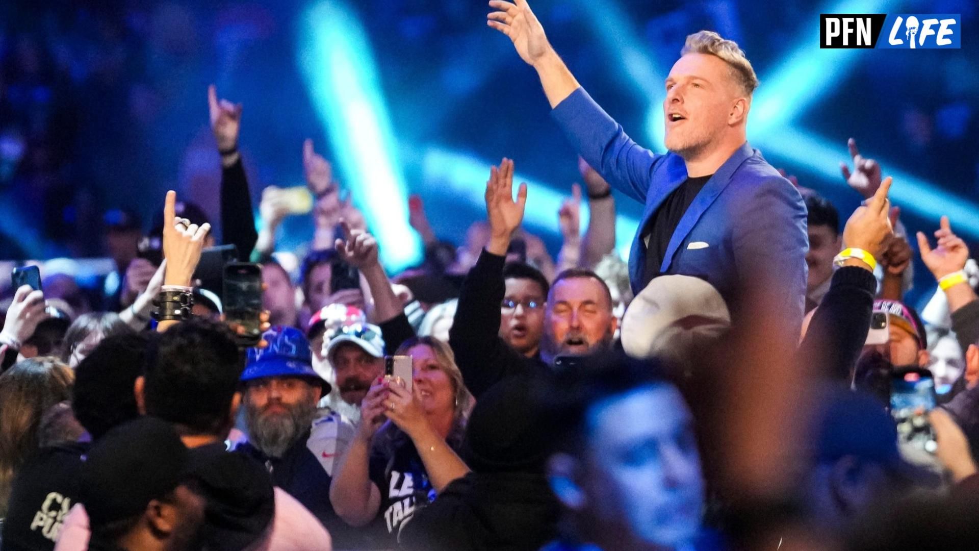 Pat McAfee enters the stadium and greets the crowd Saturday, Feb. 1, 2025, during the WWE Royal Rumble at Lucas Oil Stadium in Indianapolis.