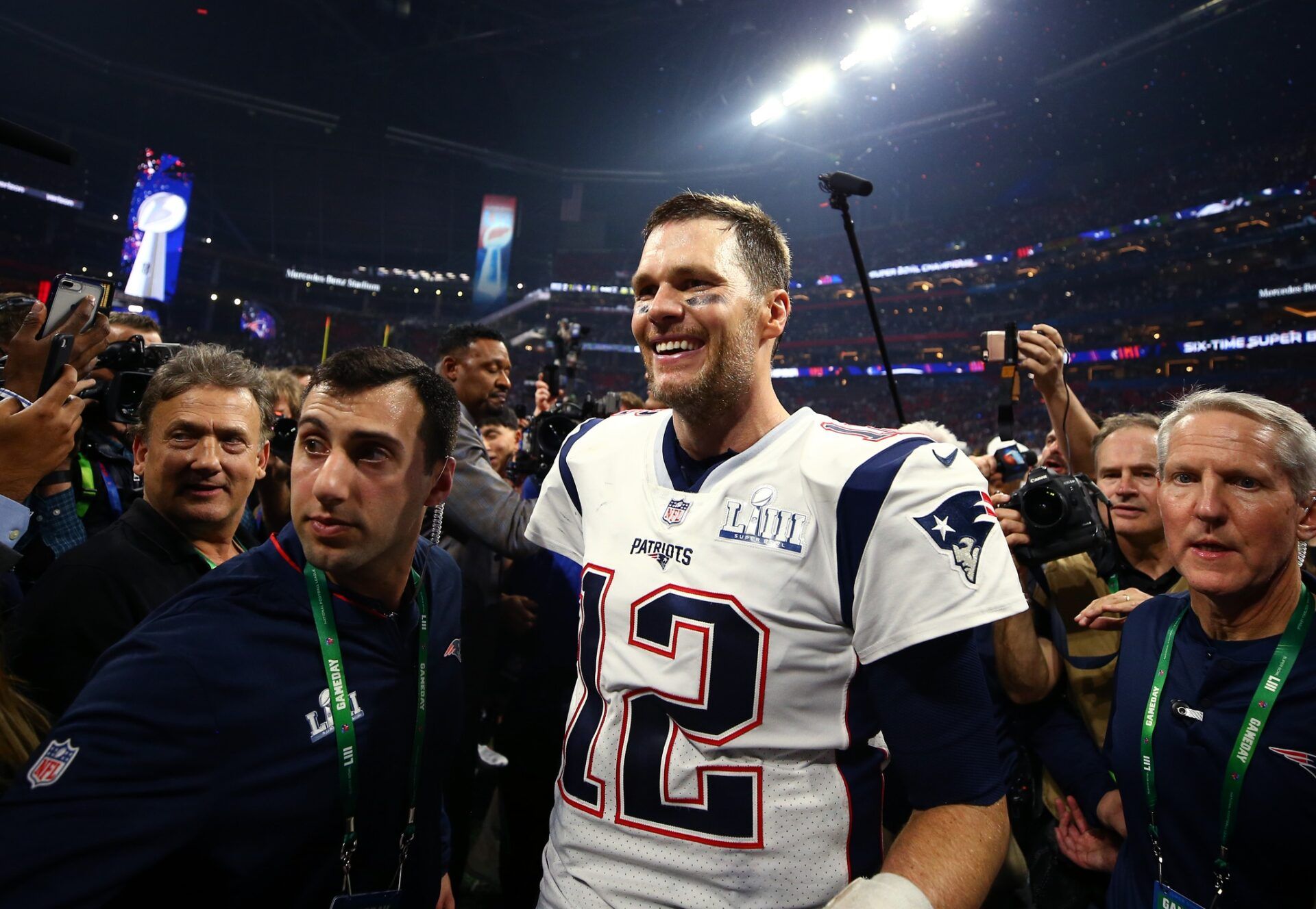 New England Patriots quarterback Tom Brady (12) celebrates after defeating the Los Angeles Rams in Super Bowl LIII at Mercedes-Benz Stadium.