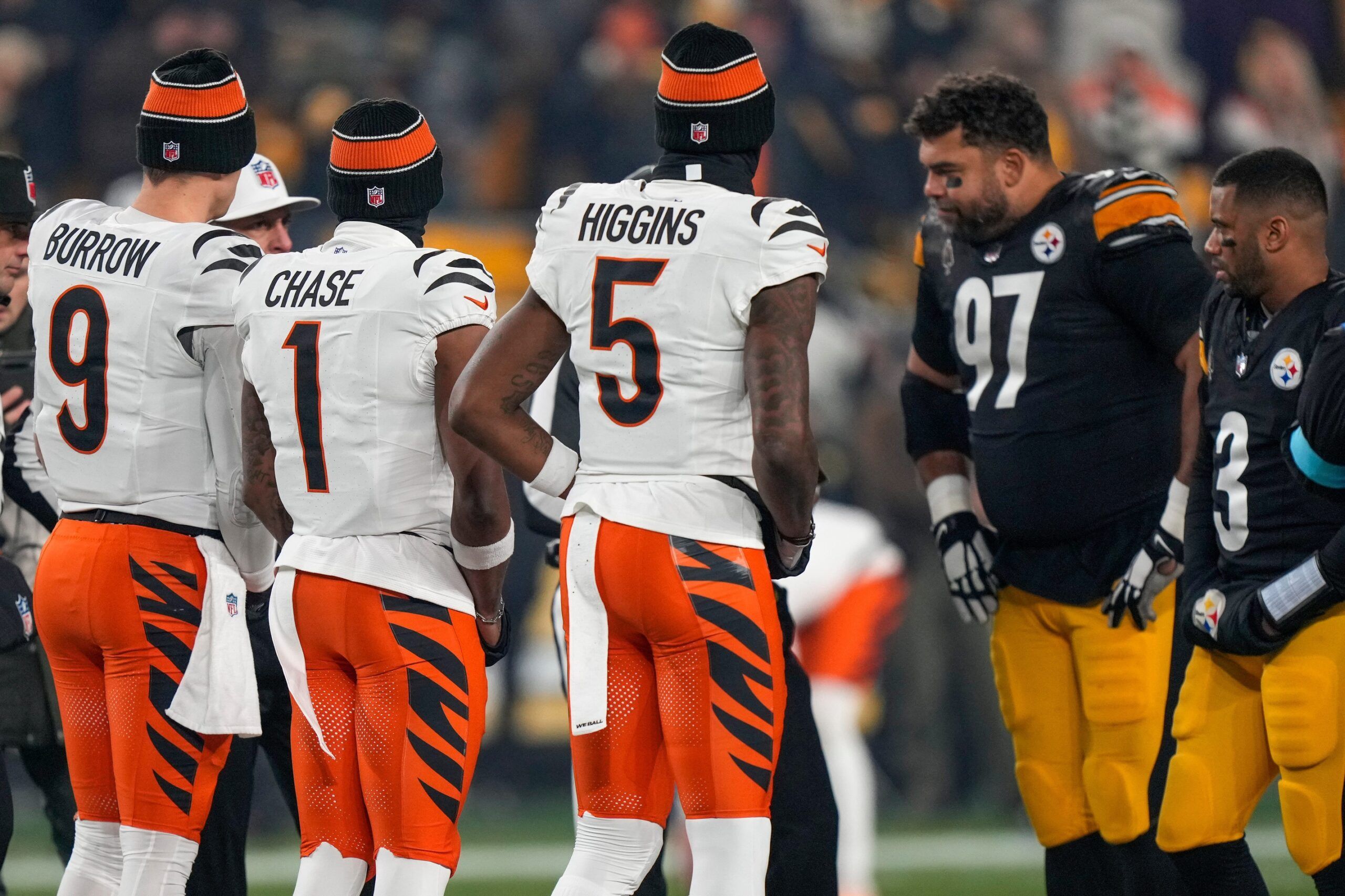 Cincinnati Bengals wide receiver Ja'Marr Chase (1), quarterback Joe Burrow (9) and wide receiver Tee Higgins (5) take the field as captains for the coin toss before the first quarter of the NFL Week 18 game between the Pittsburgh Steelers and the Cincinnati Bengals at Acrisure Stadium in Pittsburgh on Saturday, Jan. 4, 2025.