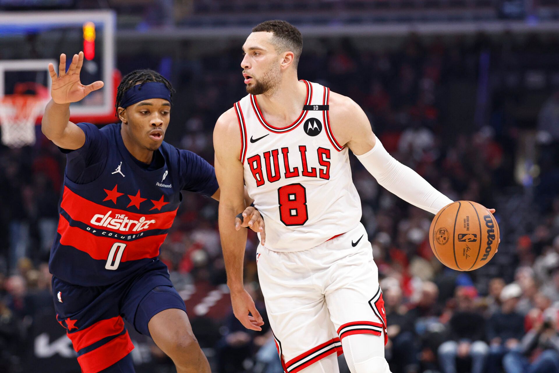 Jan 10, 2025; Chicago, Illinois, USA; Chicago Bulls guard Zach LaVine (8) drives to the basket against Washington Wizards guard Bilal Coulibaly (0) during the first half at United Center. Mandatory Credit: Kamil Krzaczynski-Imagn Images