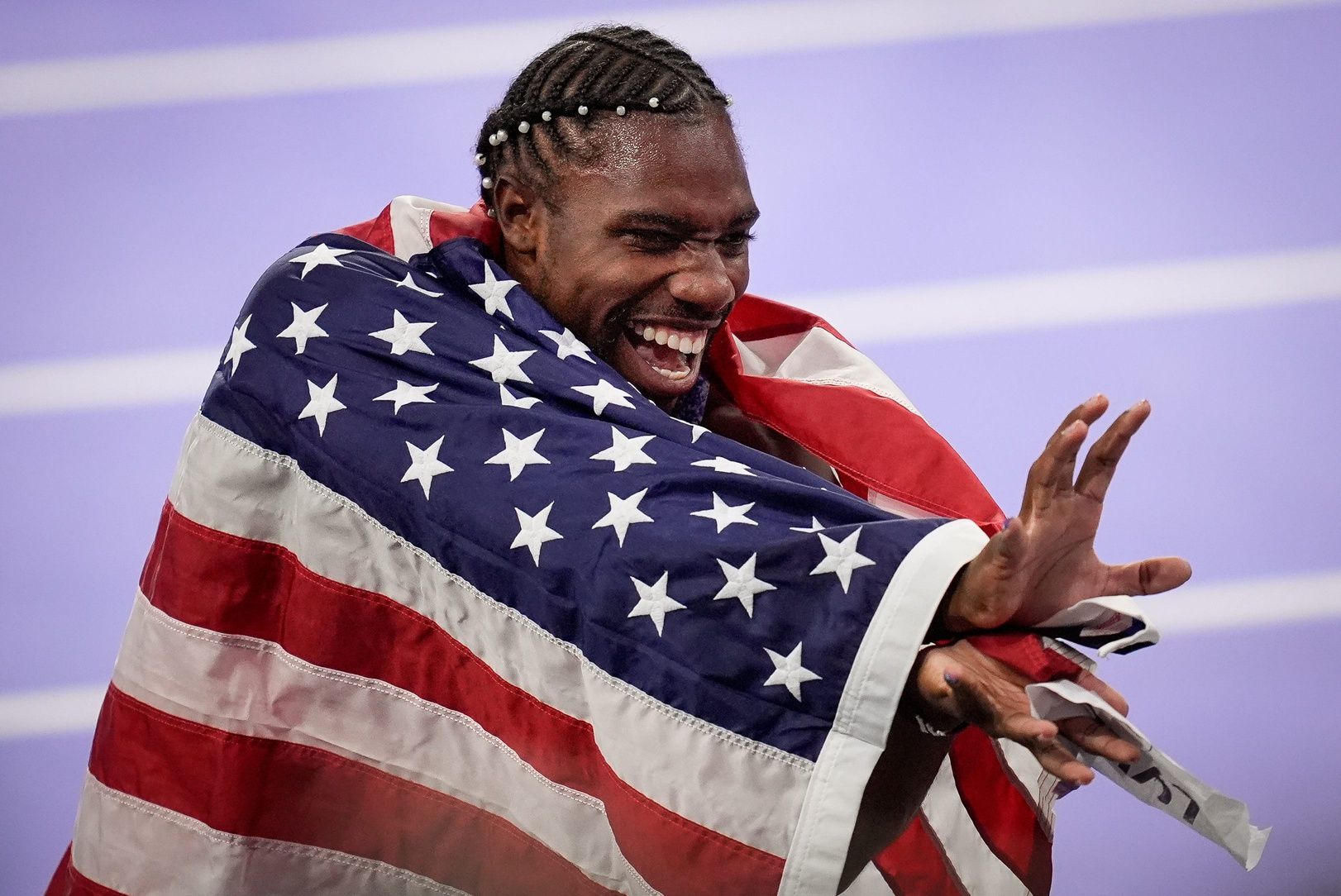 Noah Lyles (USA) celebrates after winning the men’s 100m final during the Paris 2024 Olympic Summer Games at Stade de France in Saint-Denis, France, Sunday, Aug. 4, 2024.