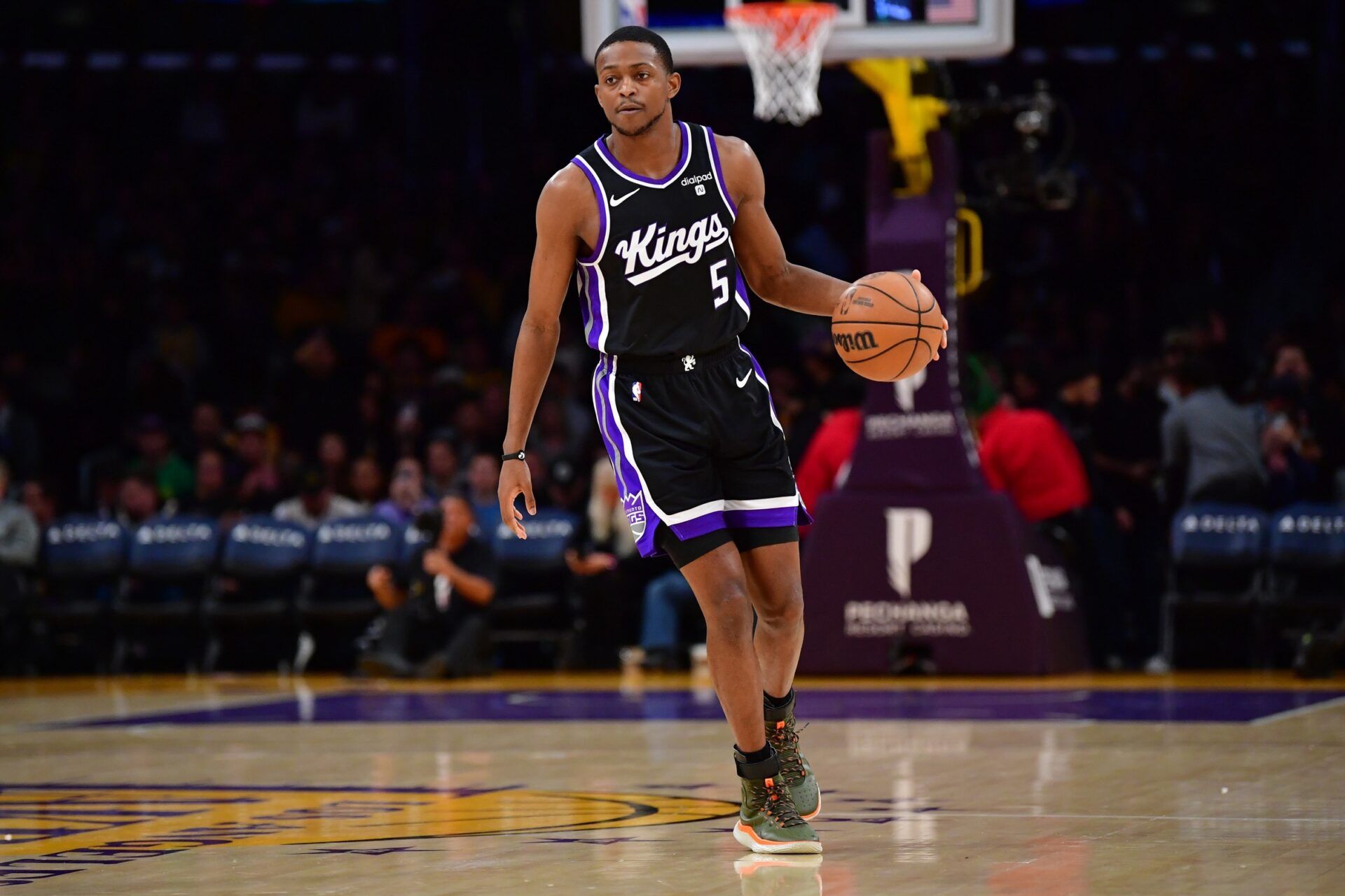 Sacramento Kings guard De’Aaron Fox (5) controls the ball against the against the Los Angeles Lakers during the first half at Crypto.com Arena.