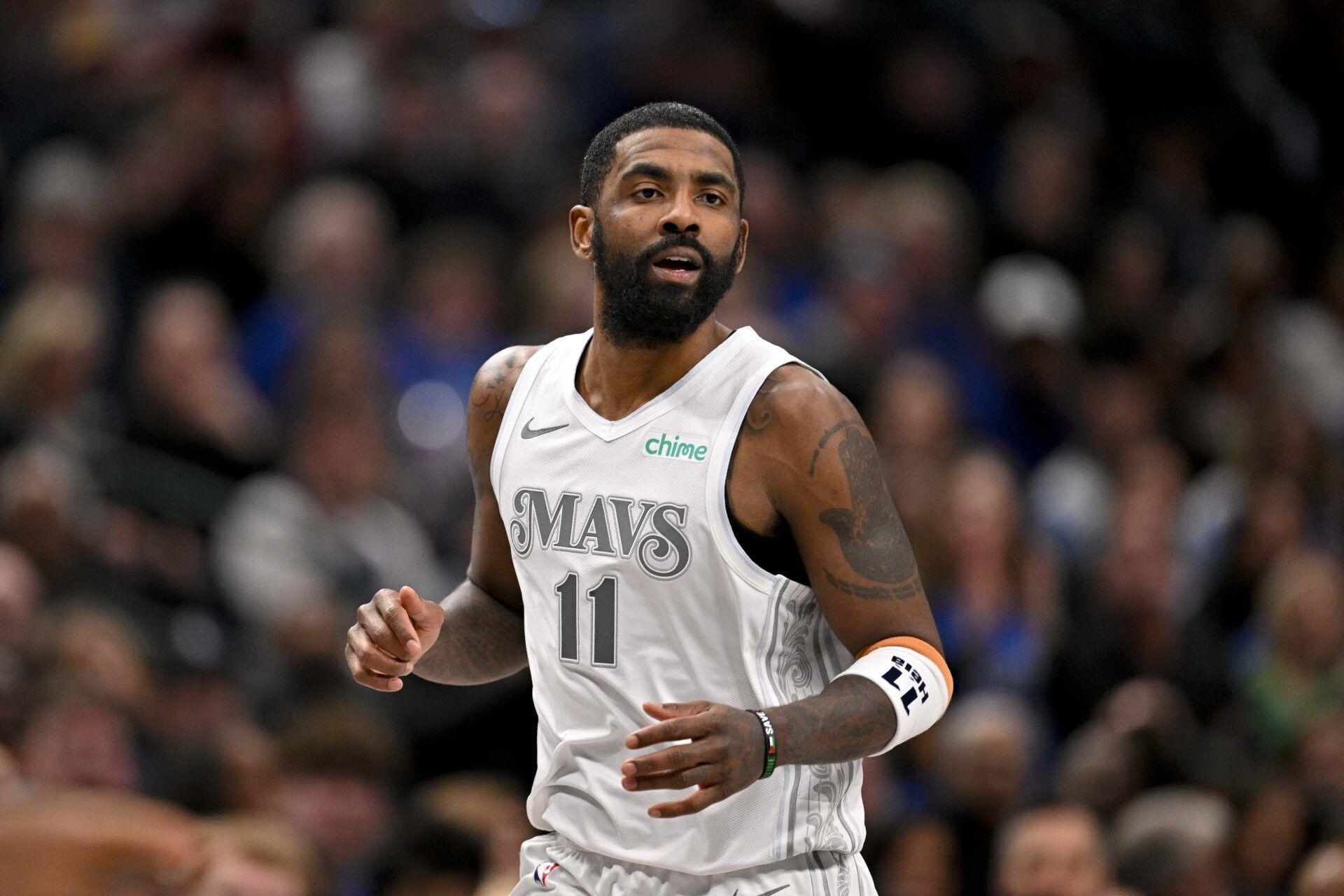 Dallas Mavericks guard Kyrie Irving (11) runs back up the court during the second half against the Minnesota Timberwolves at the American Airlines Center.