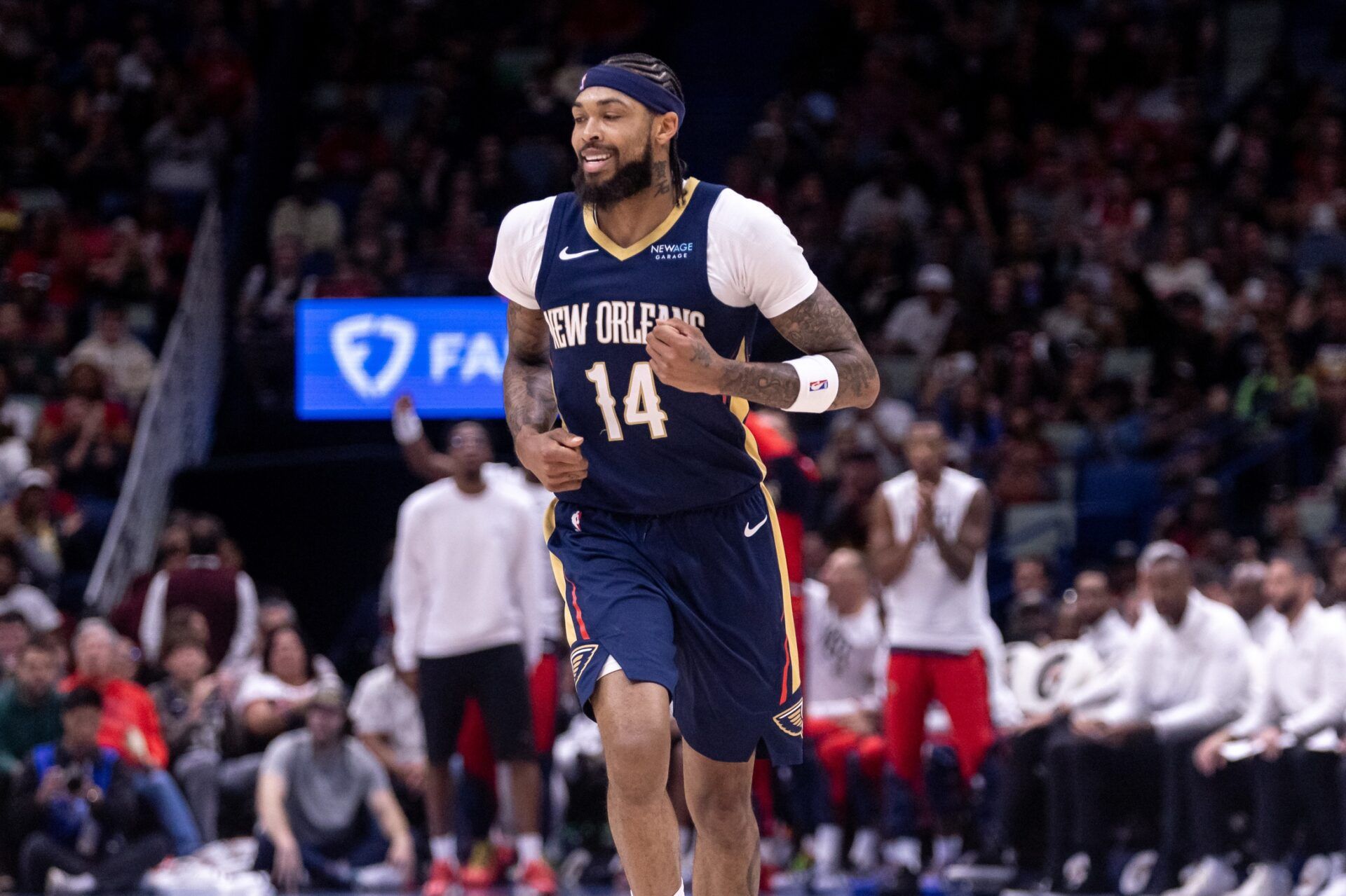 New Orleans Pelicans forward Brandon Ingram (14) reacts to making a three point basket against the Atlanta Hawks during the first half at Smoothie King Center.