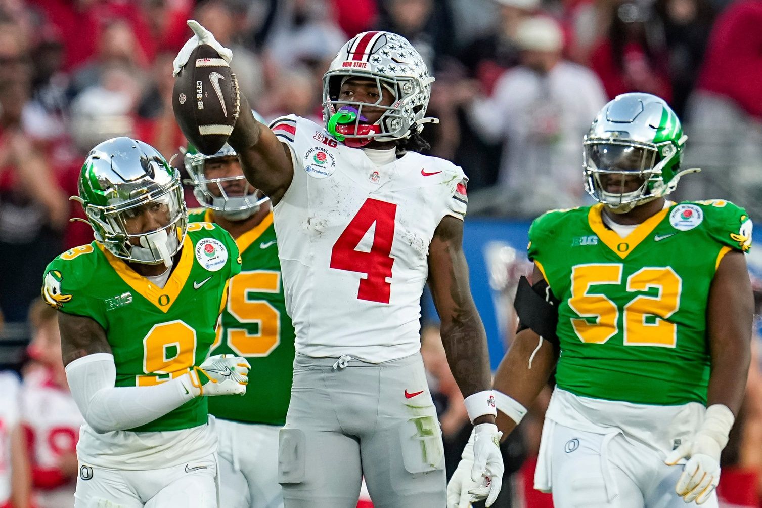 Ohio State Buckeyes wide receiver Jeremiah Smith (4) celebrates a first down catch during the second half of the College Football Playoff quarterfinal against the Oregon Ducks at the Rose Bowl.