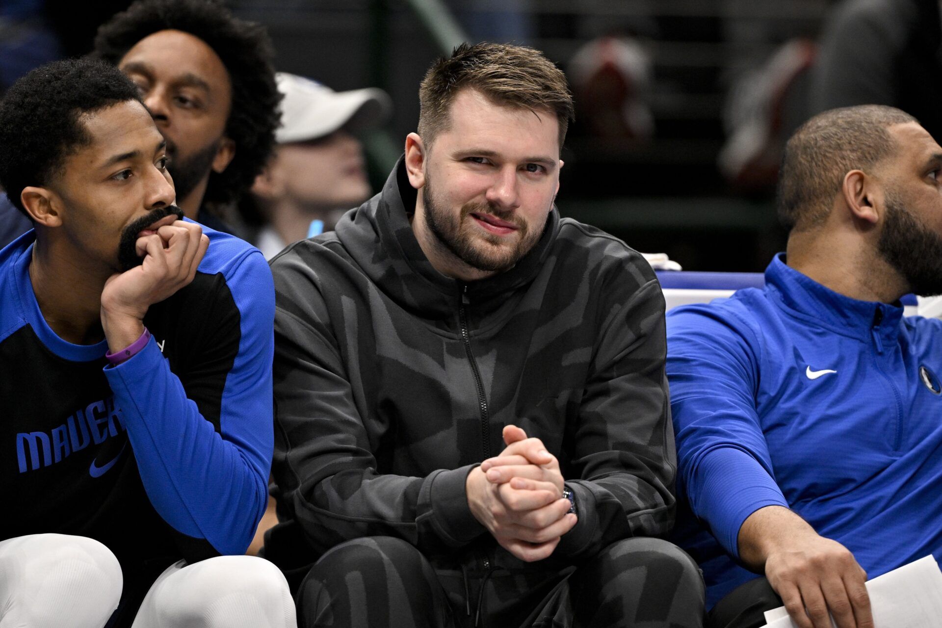 Luka Doncic looks on from the team bench during the second quarter against the Washington Wizards at the American Airlines Center.