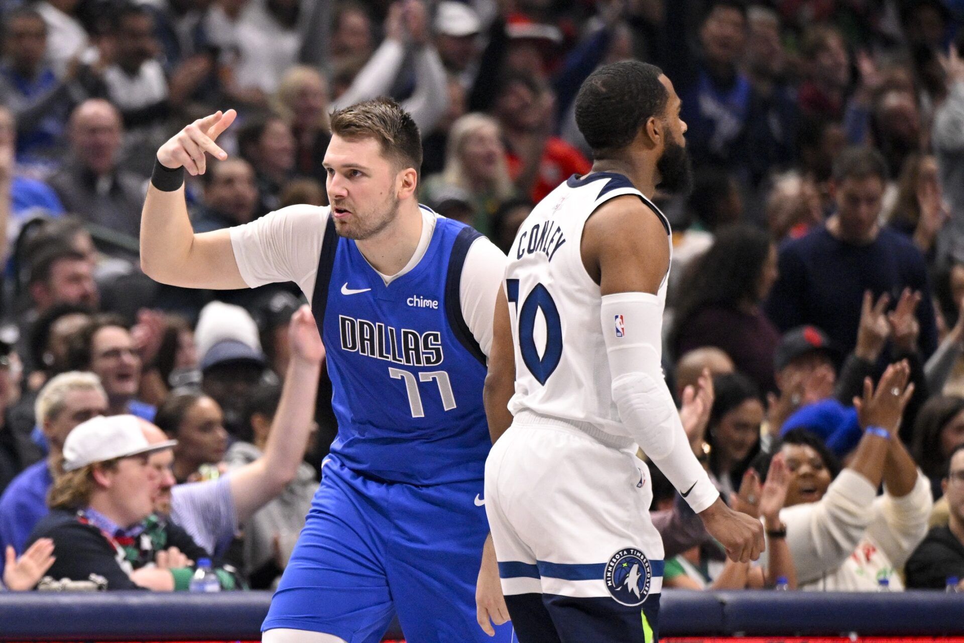 Dallas Mavericks guard Luka Doncic (77) celebrates after making a three point basket against the Minnesota Timberwolves during the first quarter at the American Airlines Center.