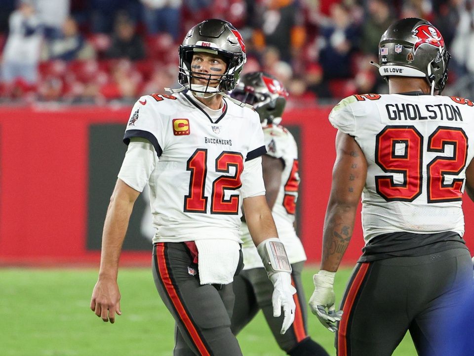 Tampa Bay Buccaneers quarterback Tom Brady (12) walks off the field in the final minute against the Dallas Cowboys in the fourth quarter during a wild card game at Raymond James Stadium.