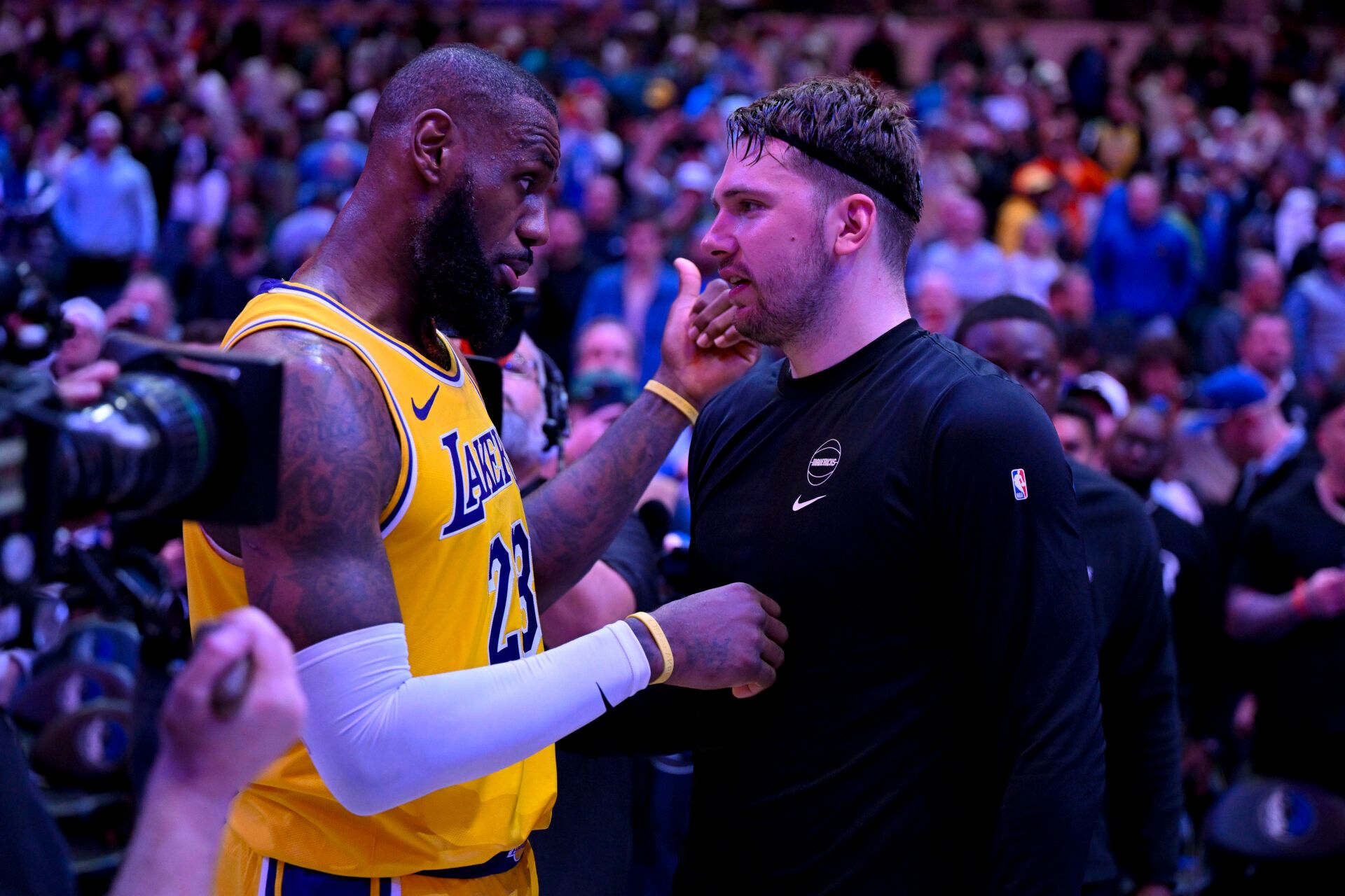 Dec 12, 2023; Dallas, Texas, USA; Los Angeles Lakers forward LeBron James (23) talks with Dallas Mavericks guard Luka Doncic (77) after the Mavericks defeat the Lakes at the American Airlines Center. Mandatory Credit: Jerome Miron-USA TODAY Sports