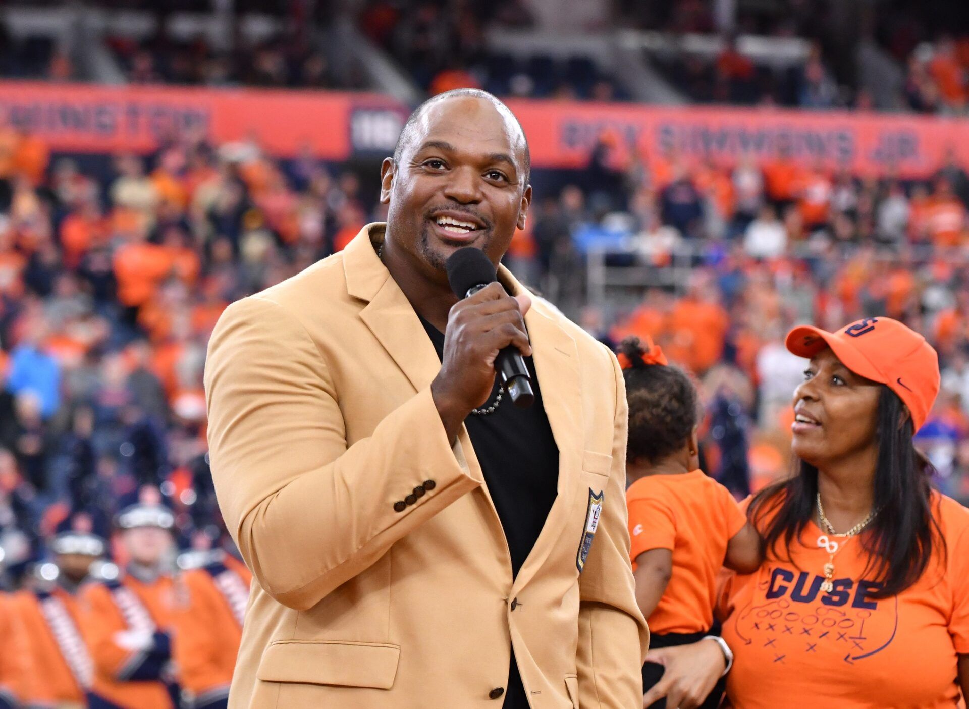 Former Syracuse Orange star and NFL Hall of Famer Dwight Freeney speaks during a ceremony to retire his jersey at the JMA Wireless Dome.