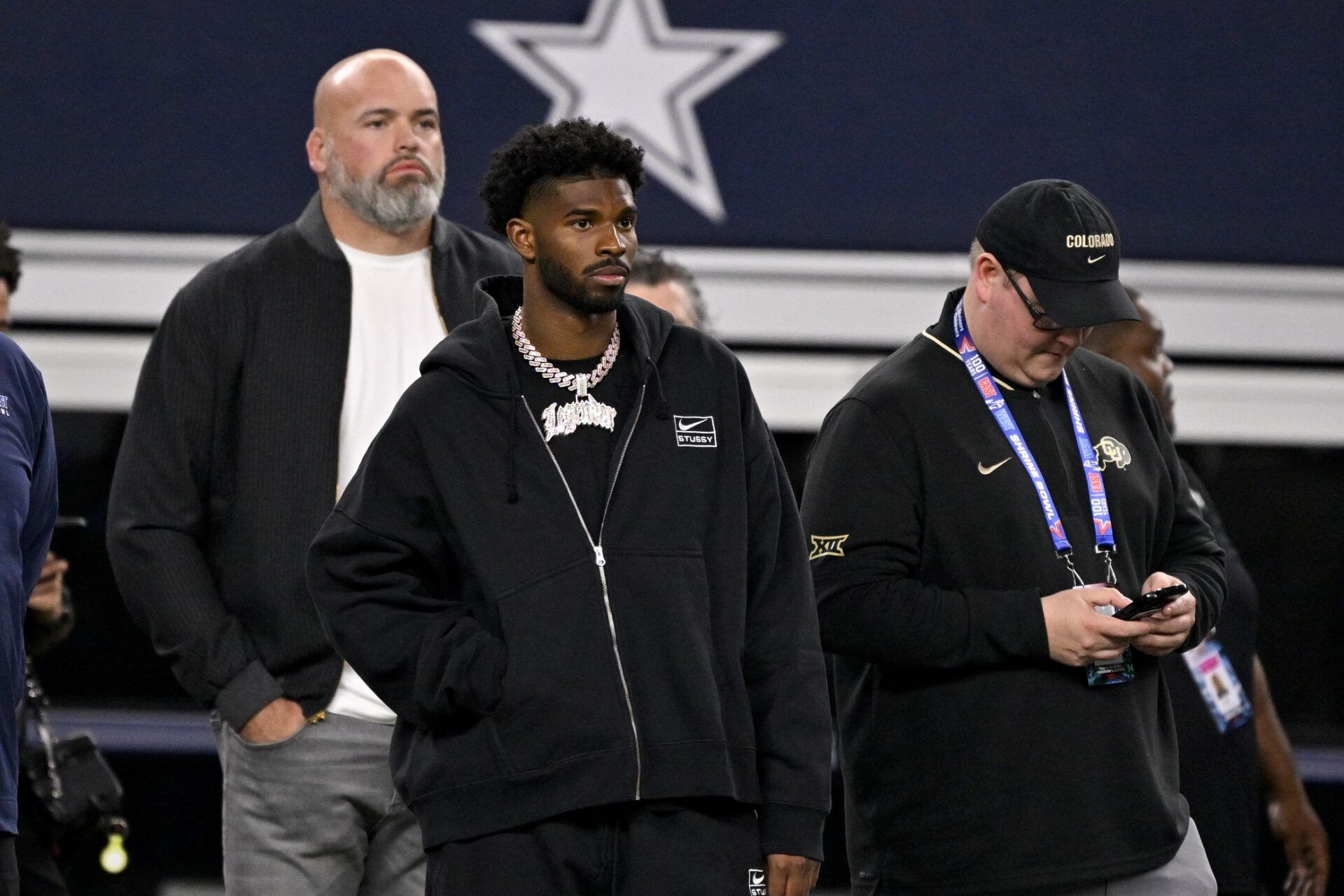 West quarterback Shedeur Sanders of Colorado (2) looks on from the sidelines during the first half against the East at AT&T Stadium.