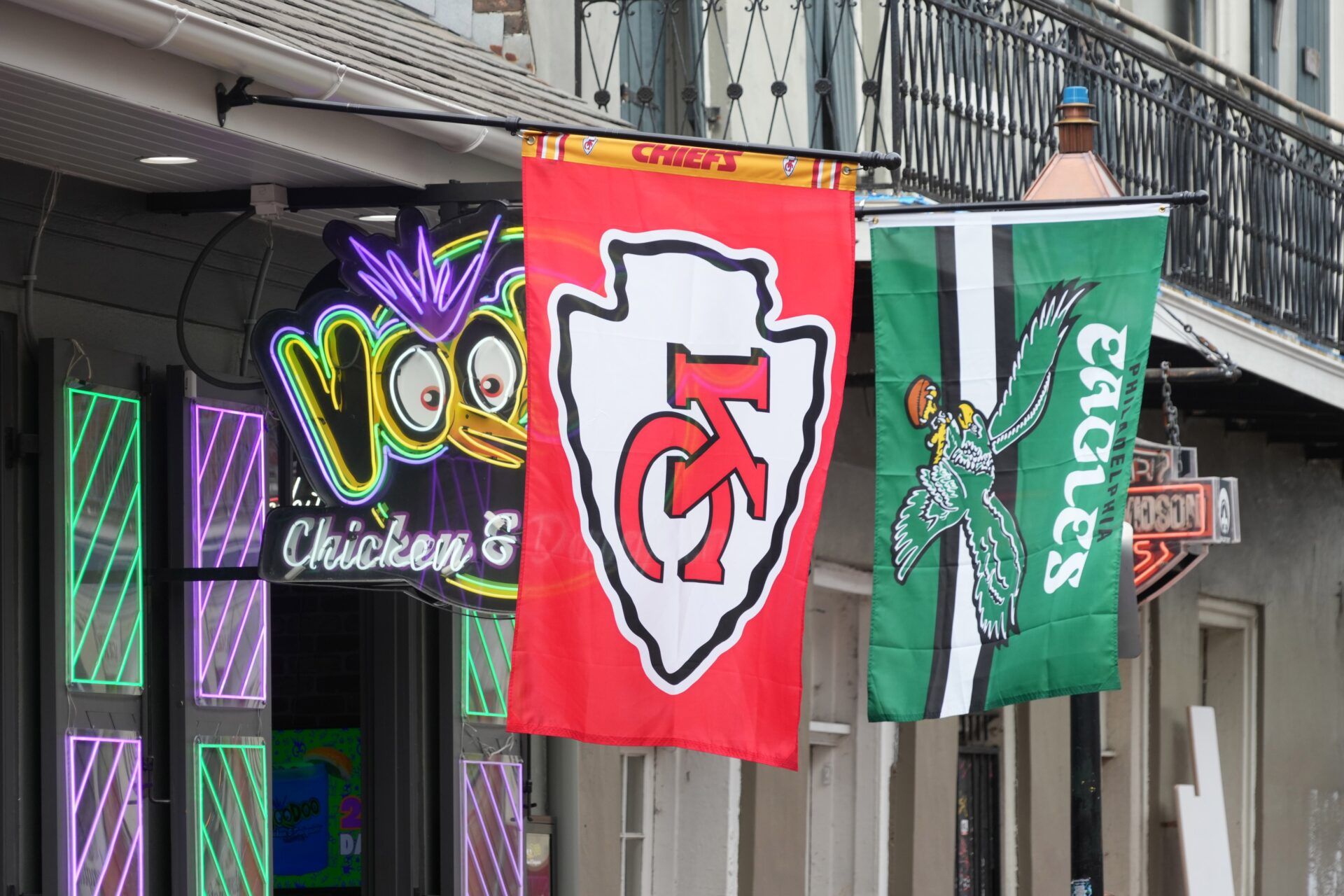 Kansas City Chiefs and Philadelphia Eagles flags at Voodoo Chicken & Daiquiris restaurant on Bourbon Street prior to Super Bowl LIX.