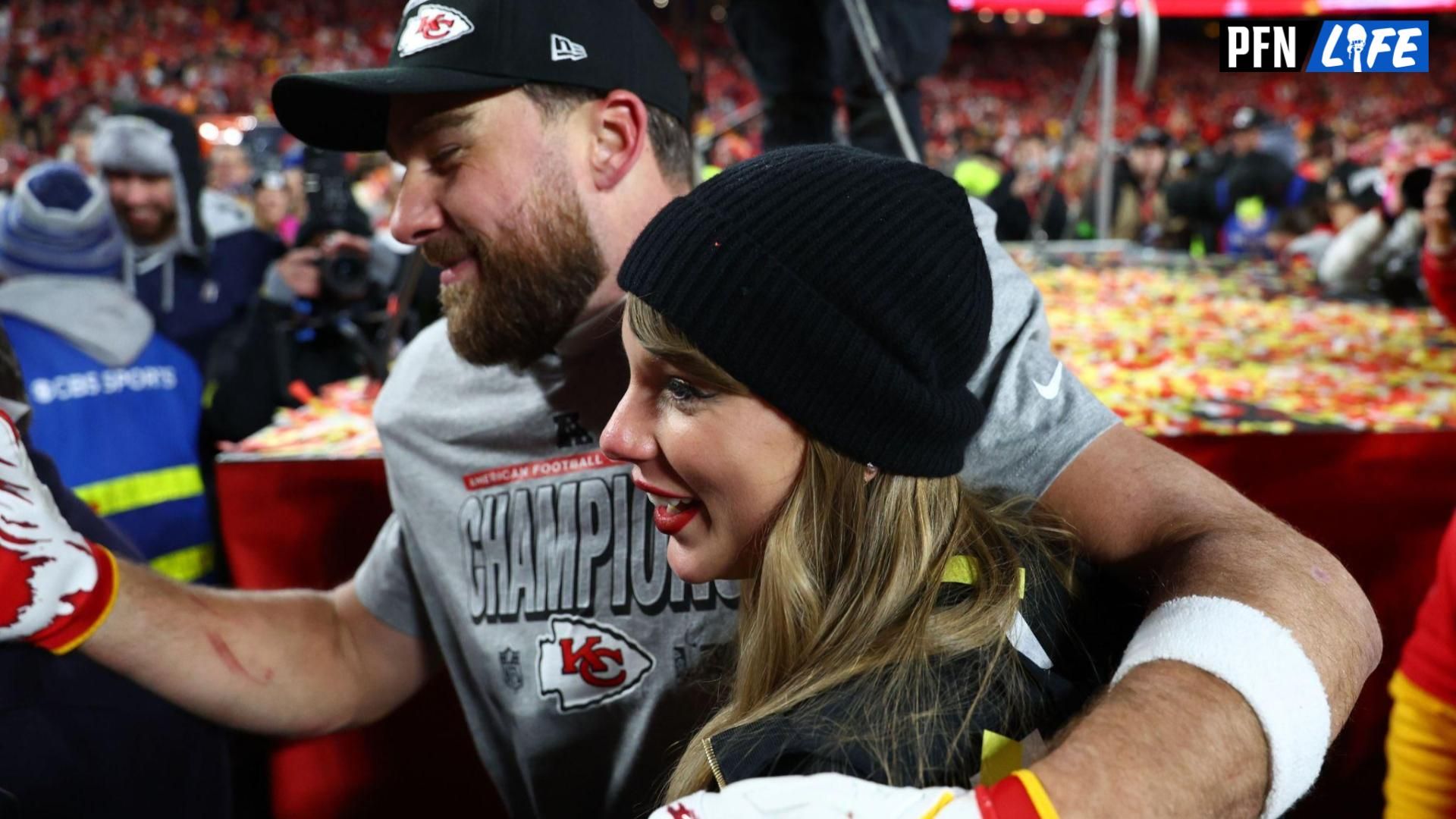 Recording artist Taylor Swift and Kansas City Chiefs tight end Travis Kelce (87) react after the AFC Championship game against the Buffalo Bills at GEHA Field at Arrowhead Stadium.