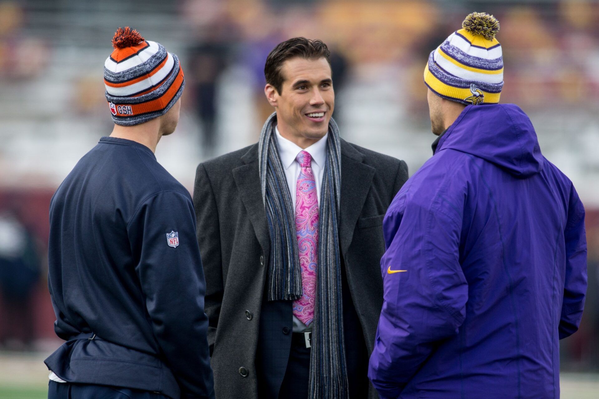 Chicago Bears quarterback Jimmy Clausen (8) and Minnesota Vikings quarterback Matt Cassel (16) talk with former quarterback and current television analyst Brady Quinn before the game at TCF Bank Stadium. The Vikings win 13-9.