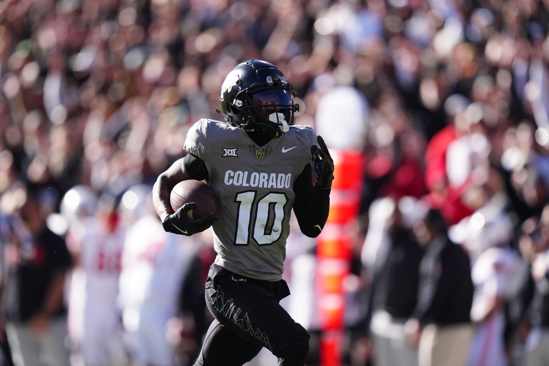 Colorado Buffaloes wide receiver LaJohntay Wester (10) returns a punt for a touchdown the first quarter against the Utah Utes at Folsom Field.