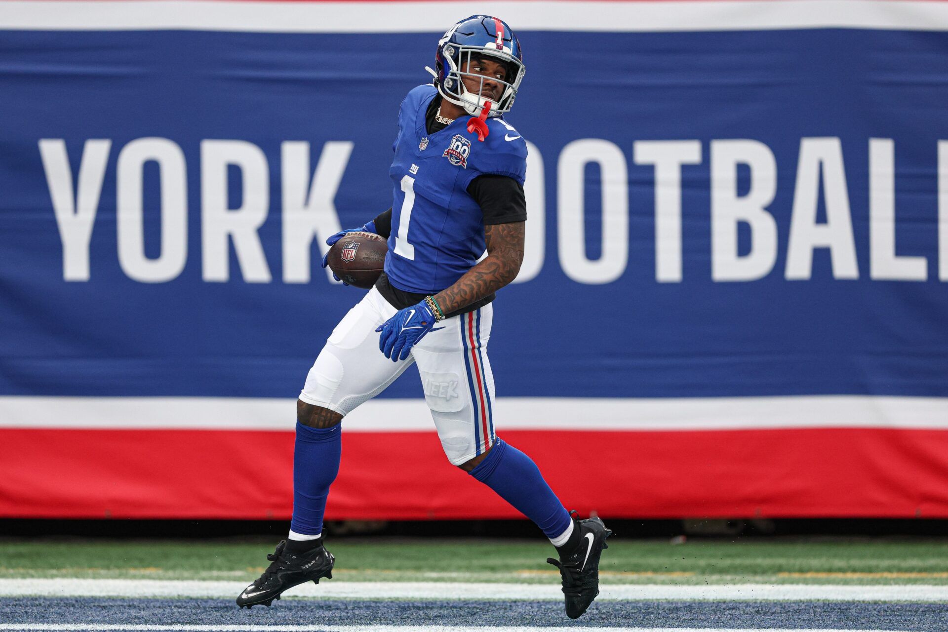 New York Giants wide receiver Malik Nabers (1) scores on a touchdown reception during the second half against the Indianapolis Colts at MetLife Stadium.