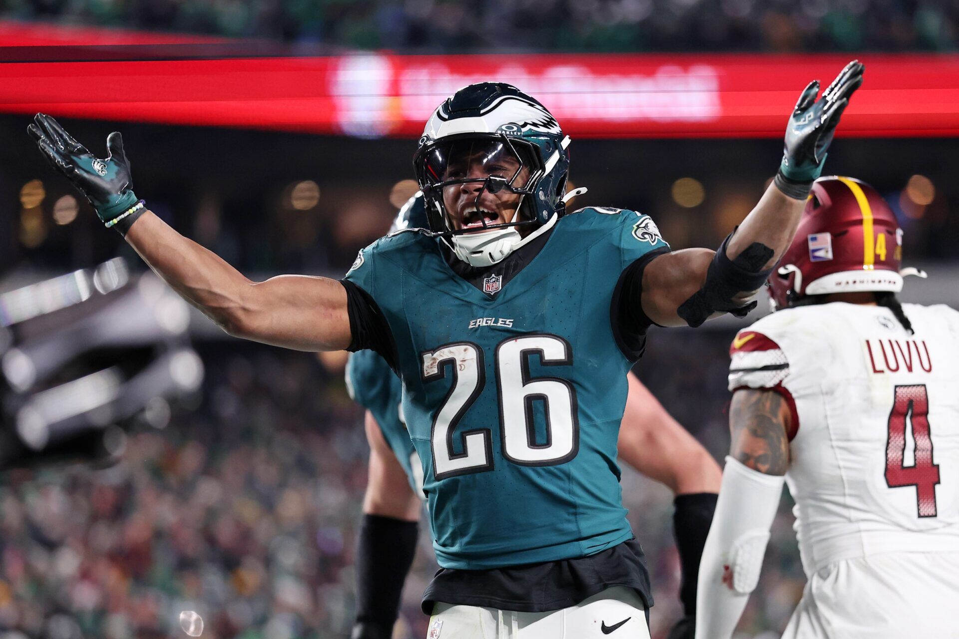 Philadelphia Eagles running back Saquon Barkley (26) celebrates after a touchdown against the Washington Commanders during the second half in the NFC Championship game at Lincoln Financial Field.